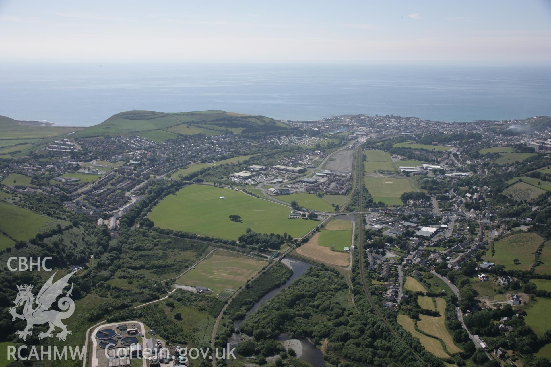 RCAHMW colour oblique aerial photograph of Aberystwyth. A wide viewfrom the east including Pen Dinas. Taken on 23 June 2005 by Toby Driver