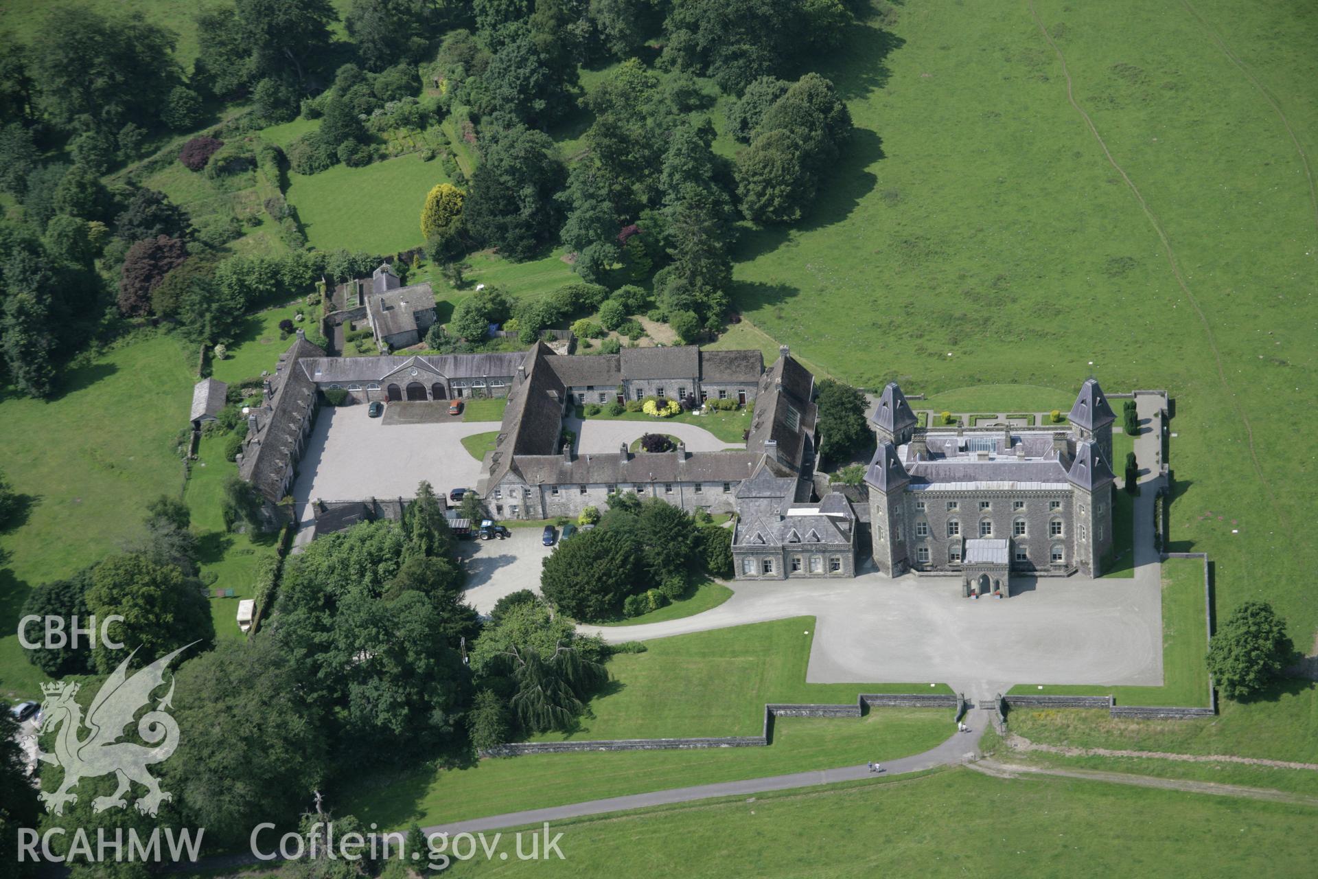 RCAHMW colour oblique aerial photograph of Newton House, (Dinefwr Castle), Llandeilo, showing clear overview of the house and buildings from the east. Taken on 11 July 2005 by Toby Driver