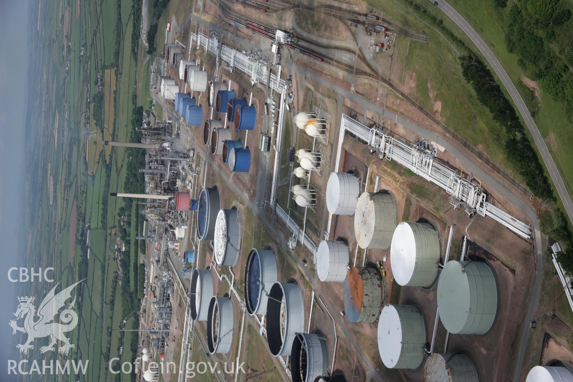 RCAHMW colour oblique aerial photograph of Amoco Oil Refinery, Milford Haven viewed from the south. Taken on 22 June 2005 by Toby Driver