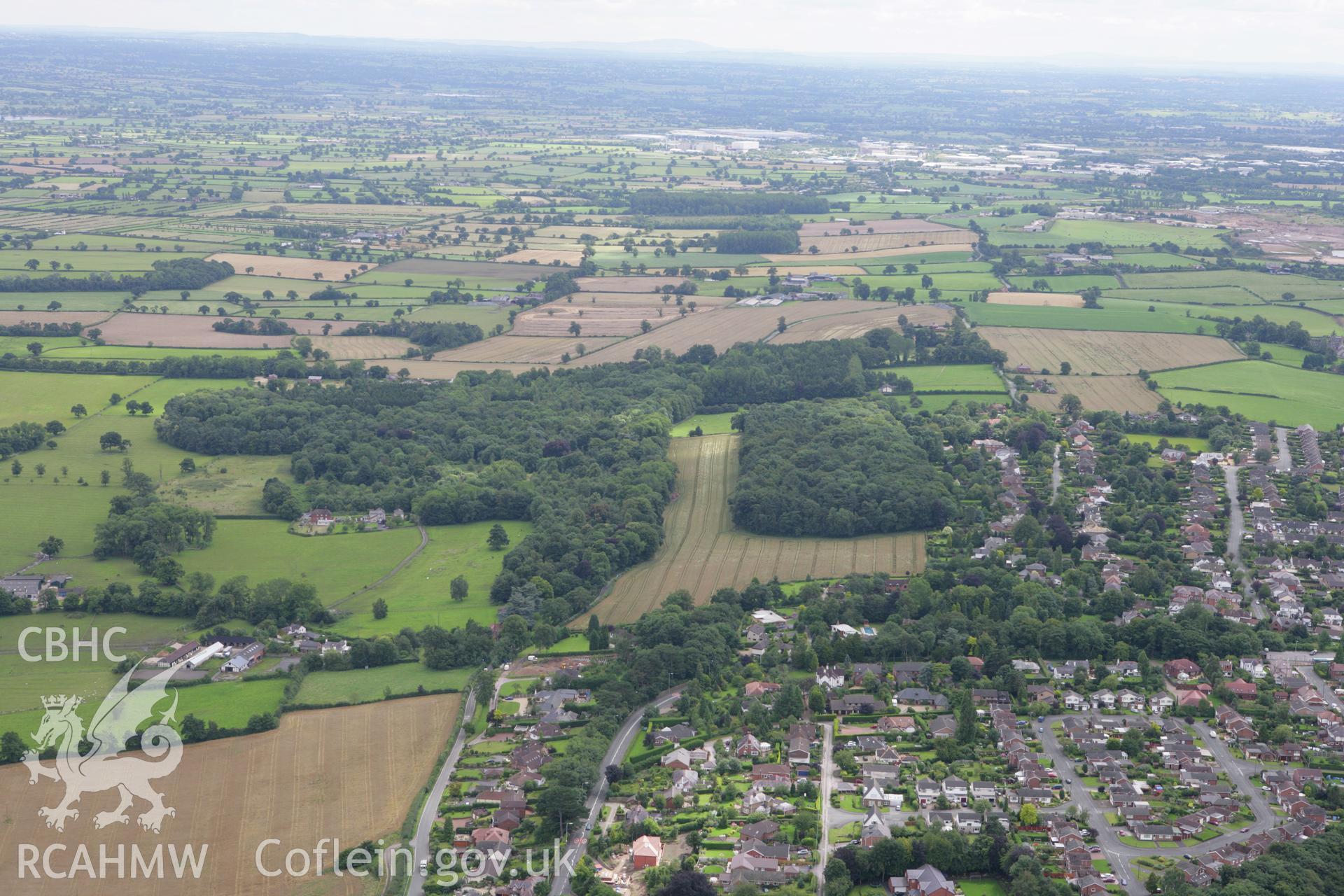 RCAHMW colour oblique aerial photograph showing suburban edge of Wrexham with Park Leigh Farm and Horsley Hall and Garden. Taken on 24 July 2007 by Toby Driver
