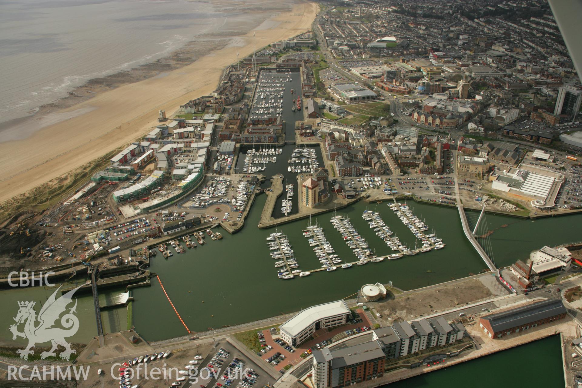 RCAHMW colour oblique aerial photograph of Swansea showing the city and docks. Taken on 16 March 2007 by Toby Driver