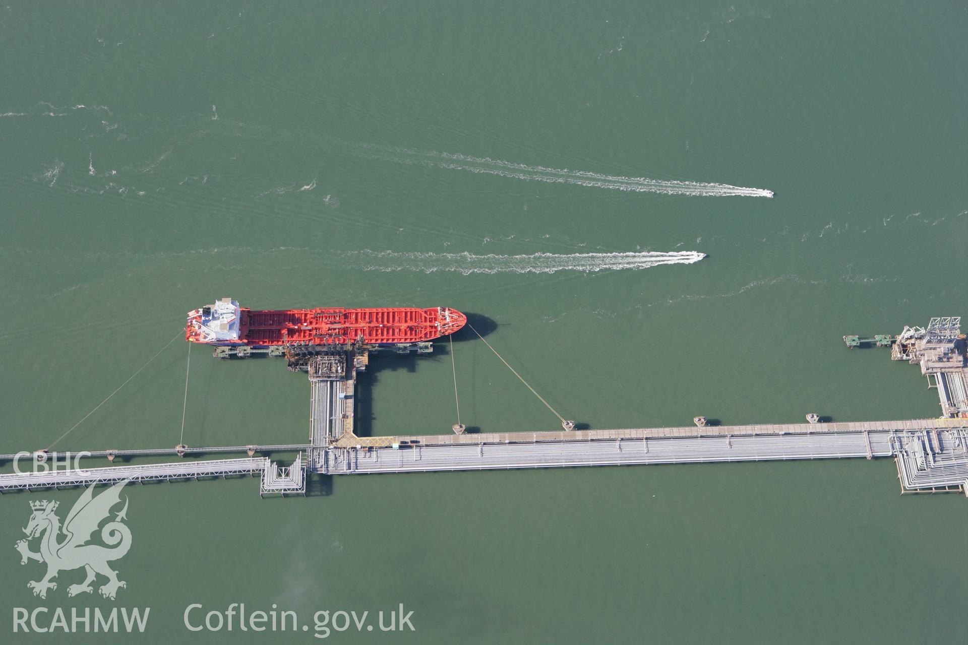 RCAHMW colour oblique aerial photograph of Milford Haven Waterway and jetty. Taken on 30 July 2007 by Toby Driver