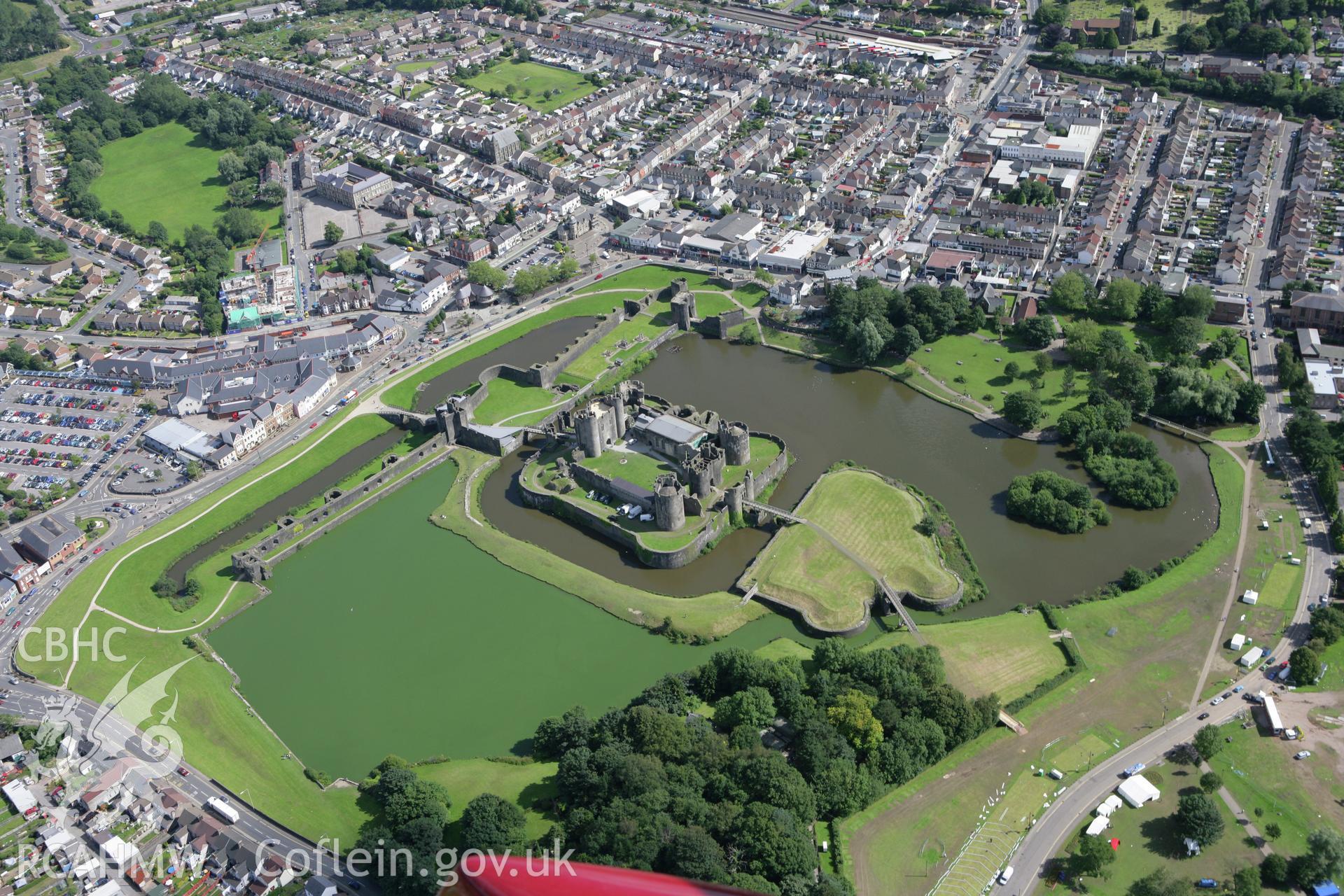 RCAHMW colour oblique aerial photograph of Caerphilly Castle. A bright summer view. Taken on 30 July 2007 by Toby Driver