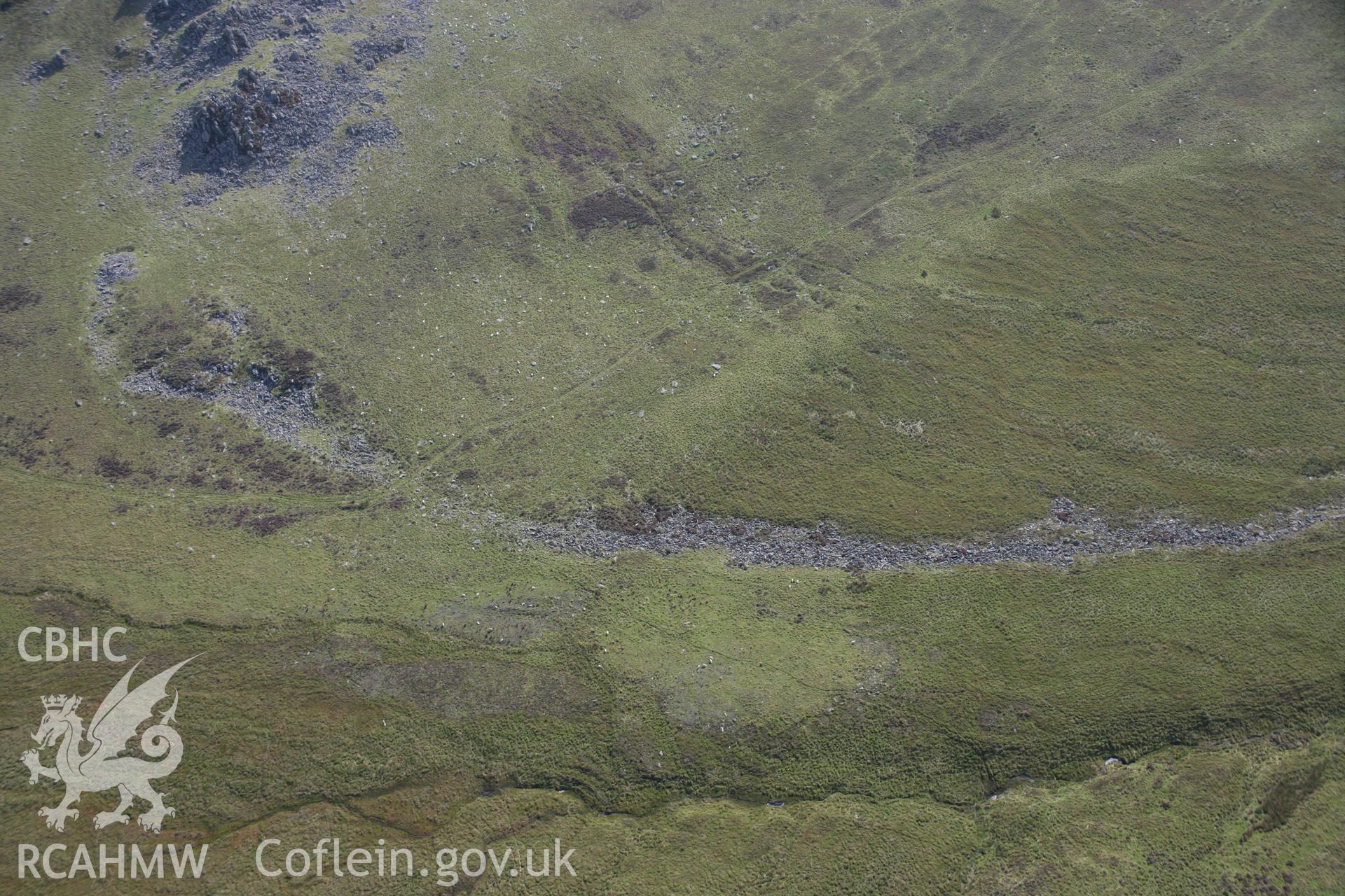 RCAHMW colour oblique photograph of Carn Menyn Cairn, showing 'stone river' below. Taken by Toby Driver on 11/09/2007.