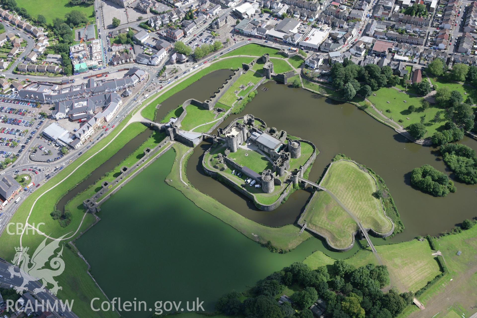 RCAHMW colour oblique aerial photograph of Caerphilly Castle. A bright summer view. Taken on 30 July 2007 by Toby Driver