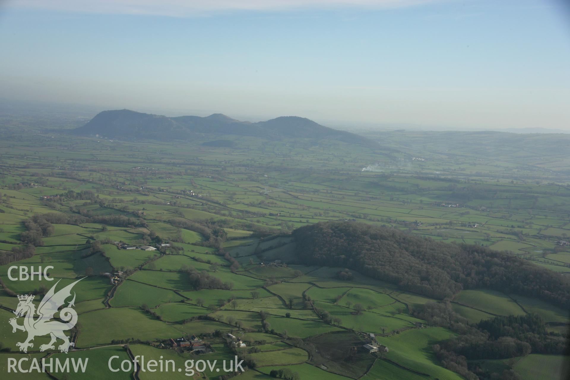 RCAHMW colour oblique aerial photograph of Gaer Fawr, Guilsfiel, and surrounding landscape. Taken on 25 January 2007 by Toby Driver