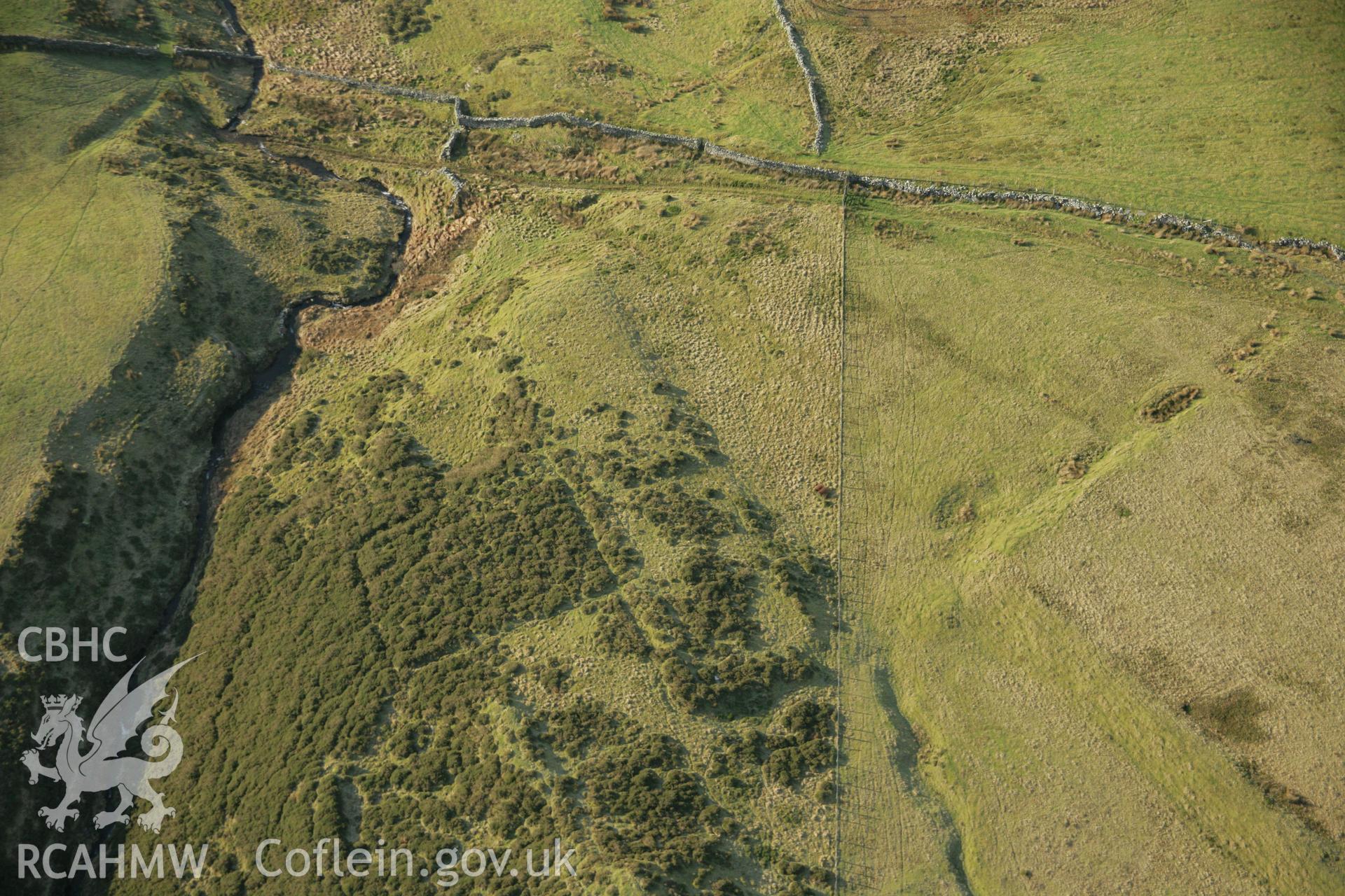 RCAHMW colour oblique aerial photograph of Tomen y Mur Roman Military Settlement. Taken on 25 January 2007 by Toby Driver