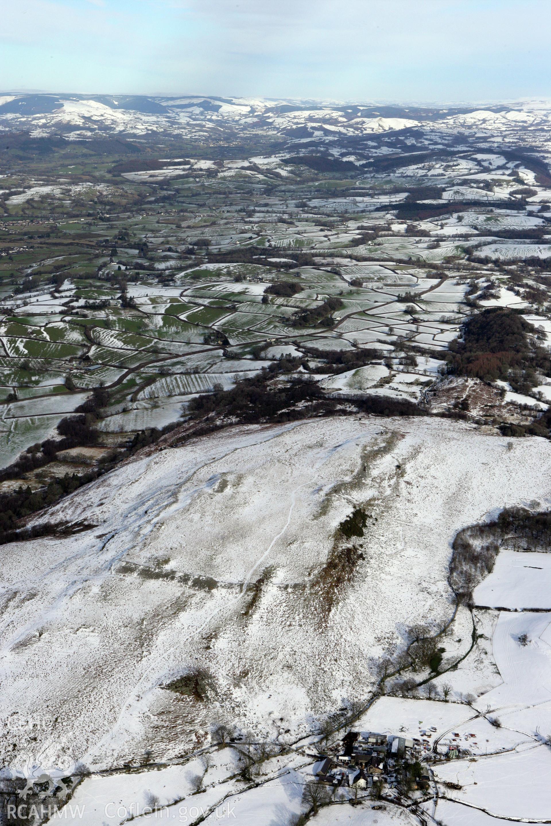 RCAHMW colour oblique photograph of Y Gaer Fawr hillfort on Carn Goch, under snow. Taken by Toby Driver on 06/02/2009.