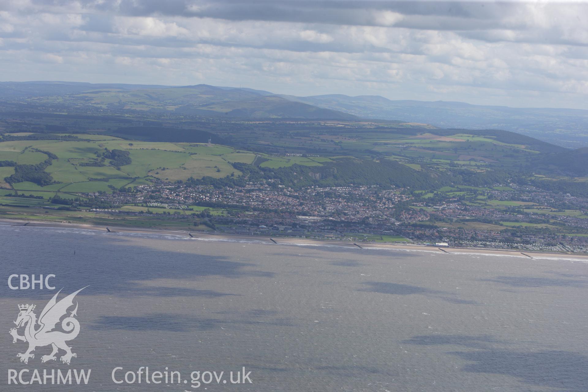 RCAHMW colour oblique aerial photograph of Prestatyn and the coast. Taken on 30 July 2009 by Toby Driver