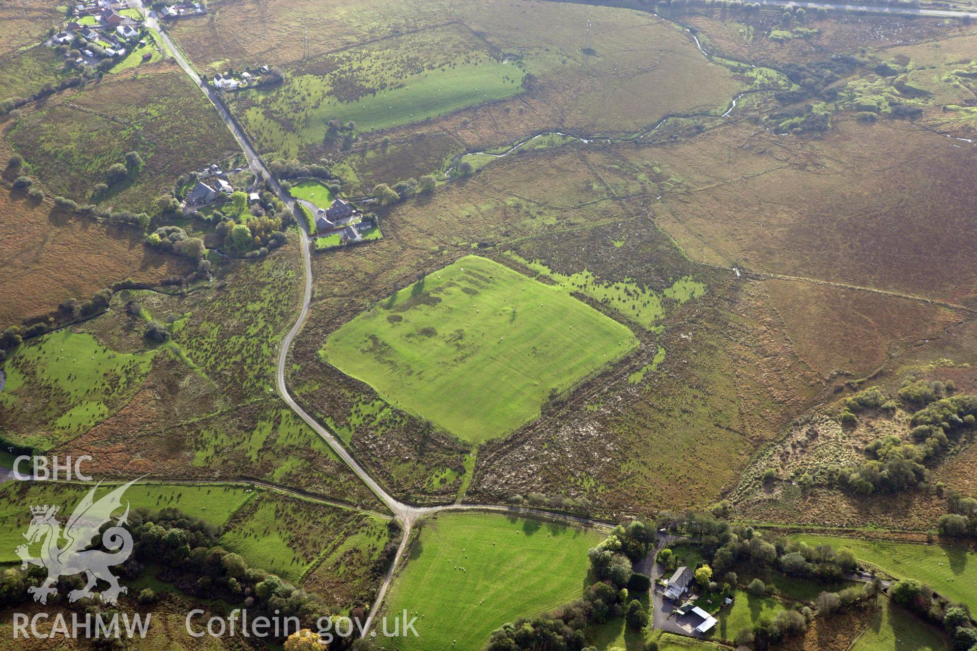 RCAHMW colour oblique aerial photograph of Coelbren Roman Fort. Taken on 14 October 2009 by Toby Driver