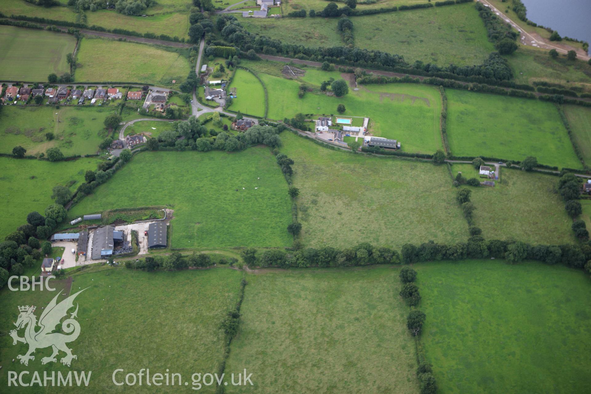 RCAHMW colour oblique aerial photograph of two sections of Wat's Dyke between Clawdd Offa and Pigeon House Farm. Taken on 30 July 2009 by Toby Driver