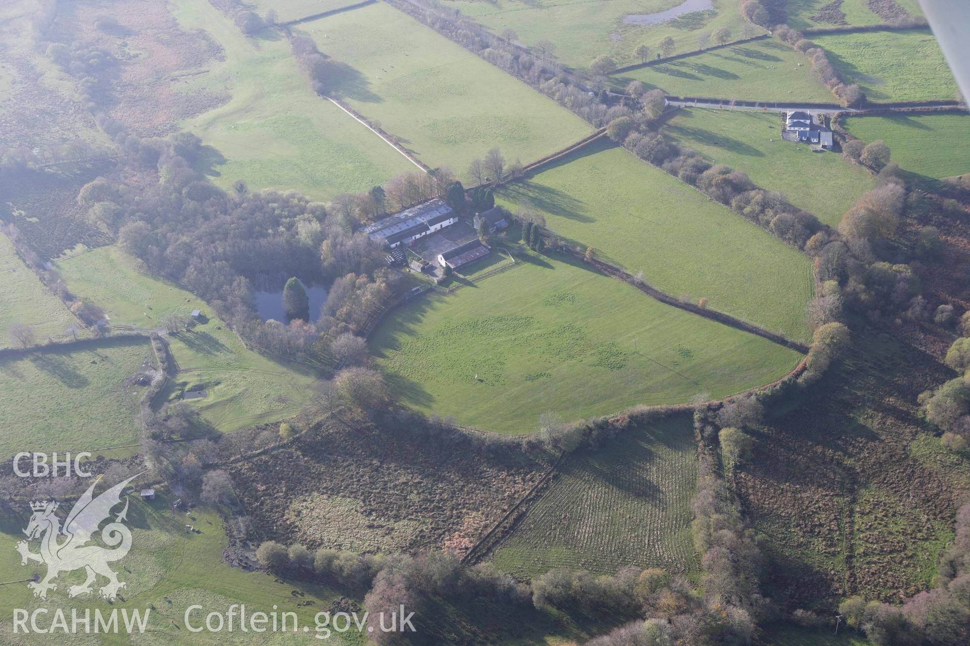 RCAHMW colour oblique aerial photograph of Llanio Roman Fort. Taken on 09 November 2009 by Toby Driver