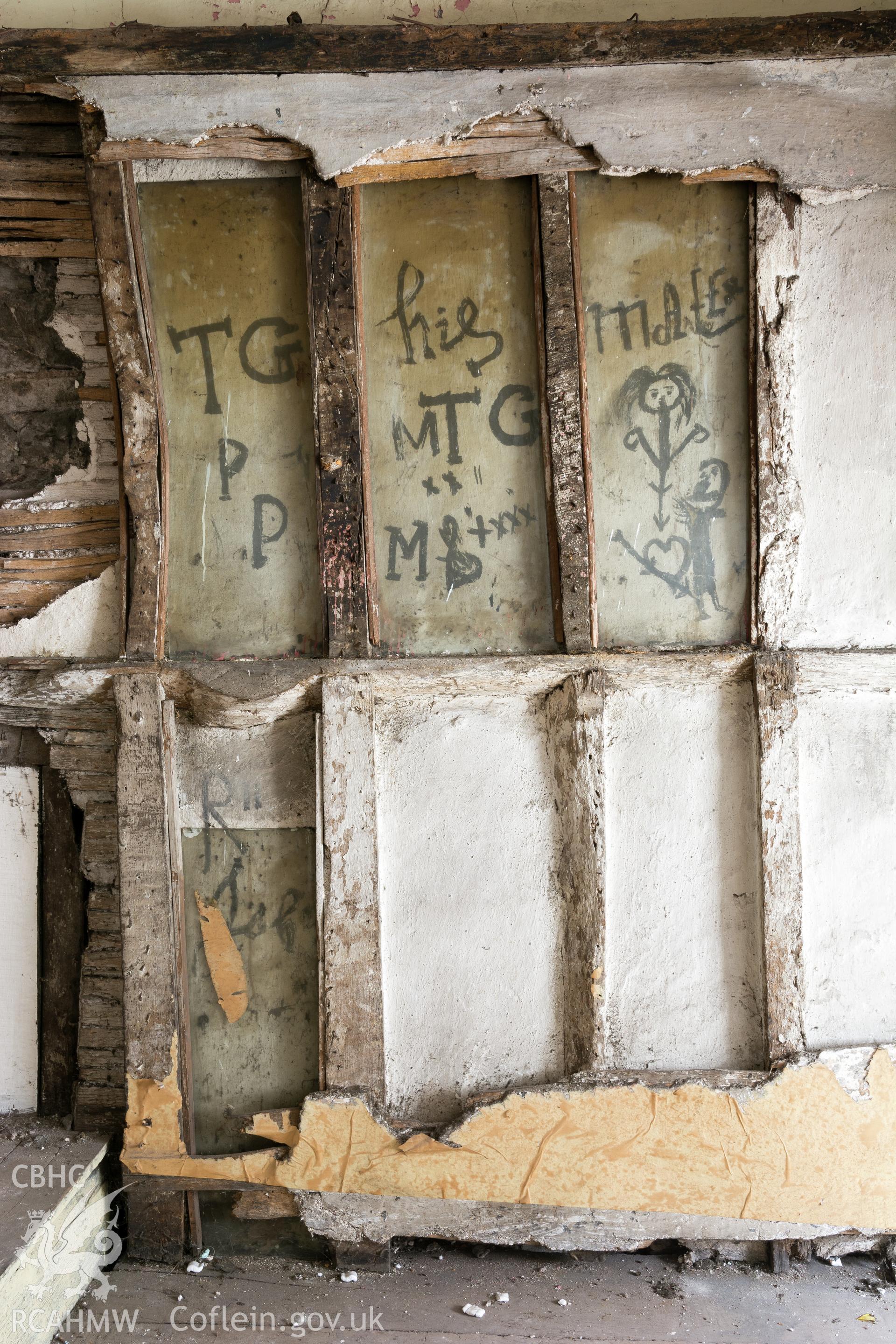Attic Chapel  re-set partition with C17th graffiti, taken by Martin Crampin for RCAHMW 21st March 2017.