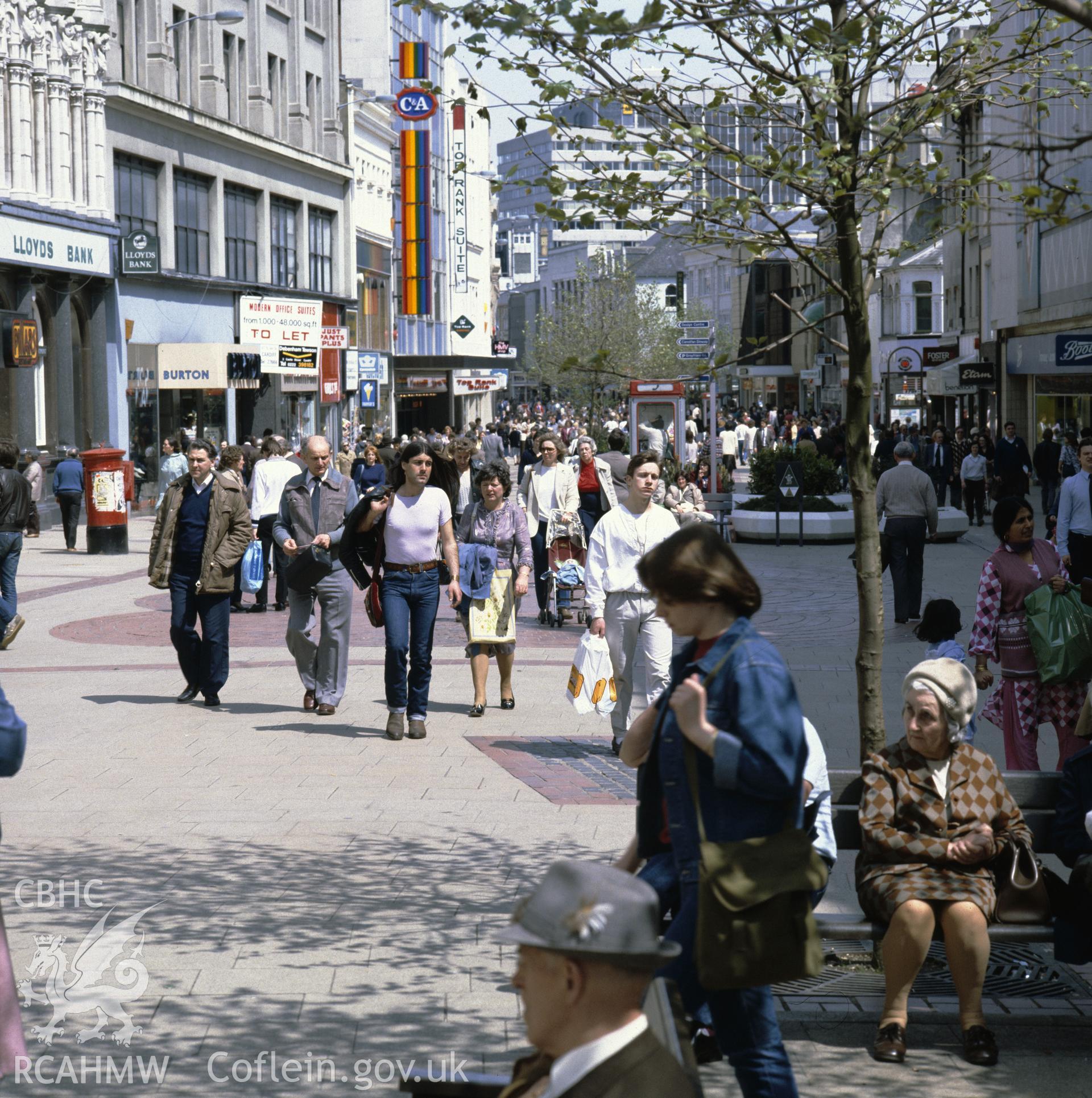 1 colour transparency showing street scene in central Cardiff with shoppers; collated by the former Central Office of Information.