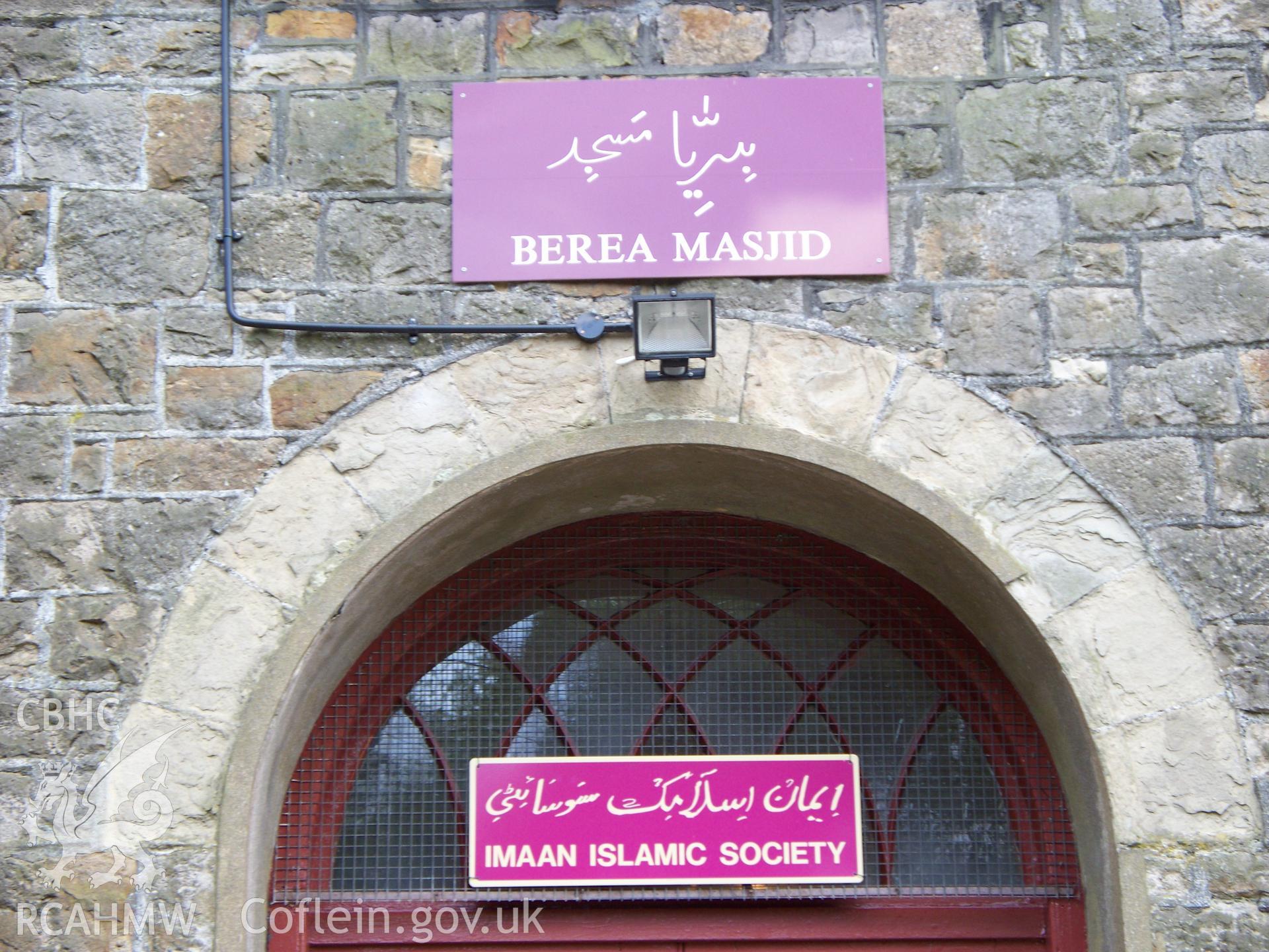 `Berea Masjid? & `Imaan Islamic Society? signs in Arabic and English over the main door.