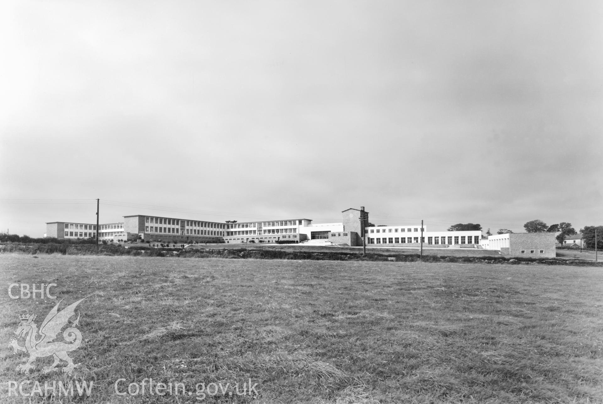 1 b/w print showing exterior view of Ysgol Syr Thomas Jones, Amlwch; collated by the former Central Office of Information.