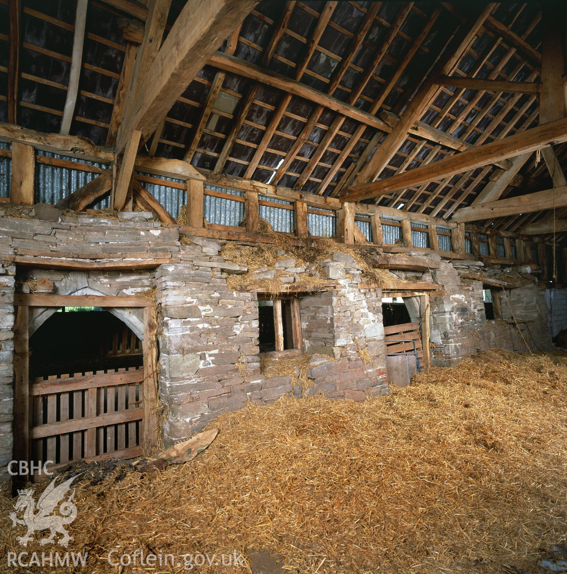 RCAHMW colour transparency showing an interior view of the east wall end of the cowhouse at Clyro Court Farm, taken by Fleur James, August 2003