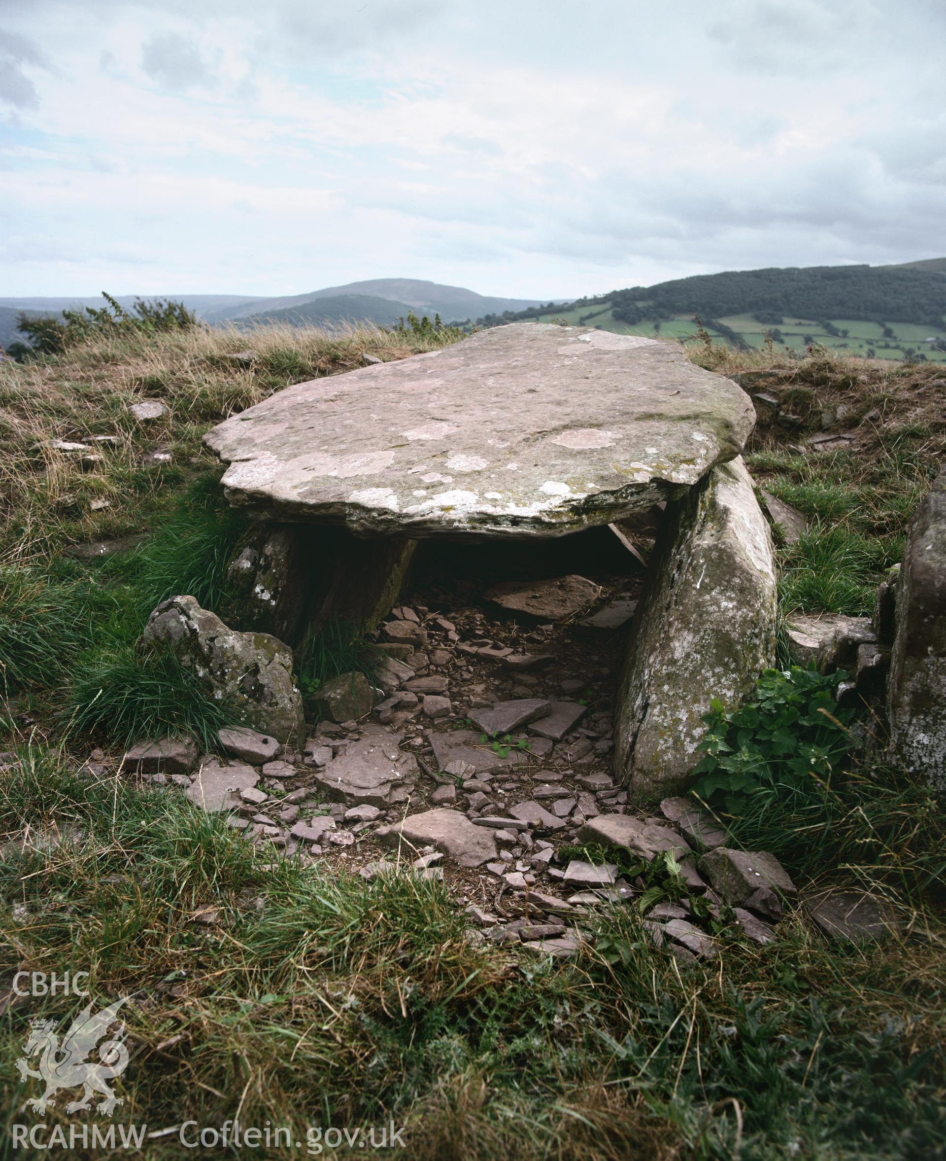 Colour transparency showing a view of Ty Illtud chambered tomb, produced by Iain Wright, c.1981