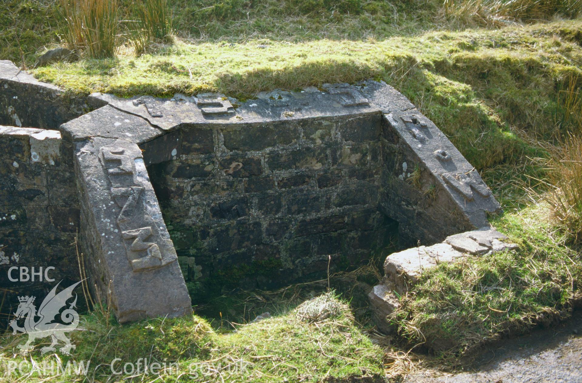 A concrete drainage culvert built by Italian Prisoners of War alongside a military road ('Op Road') on Sennybridge Training Area in 1944, inscribed in raised concrete lettering '573 PoW 1945'.