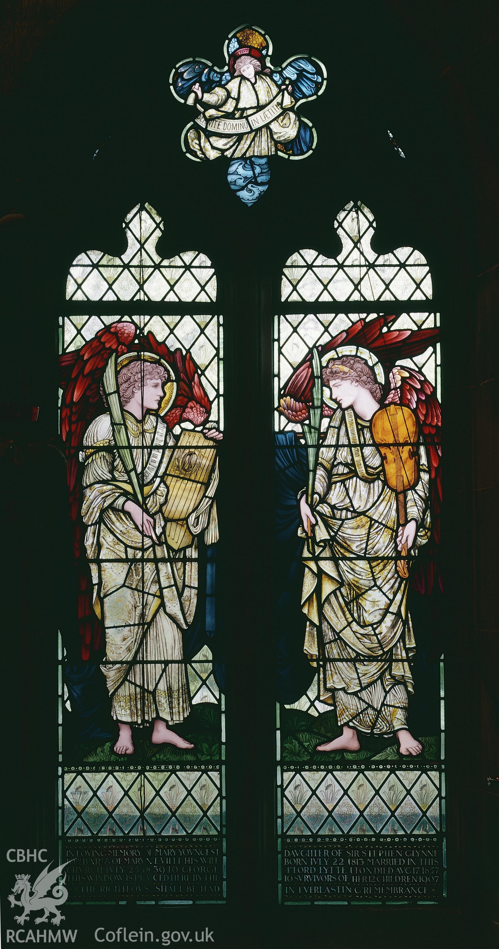 RCAHMW colour transparency of an interior view of a stained glass window depicting angels playing violins and lutes, designed by Edward Burne-Jones, at Hawarden Church.
