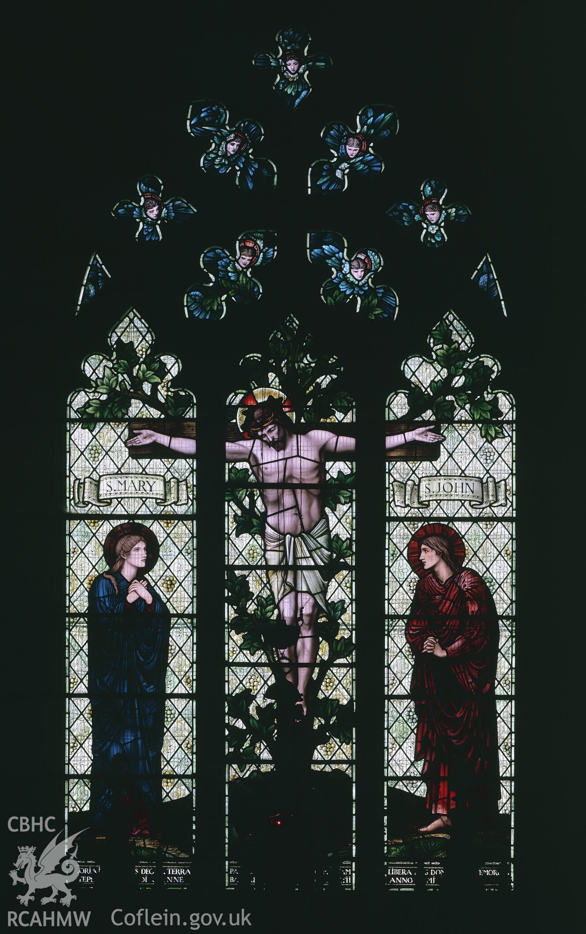 RCAHMW colour transparency of an interior view of a stained glass window depicting the crucifiction, designed by Edward Burne-Jones, at Hawarden Church.