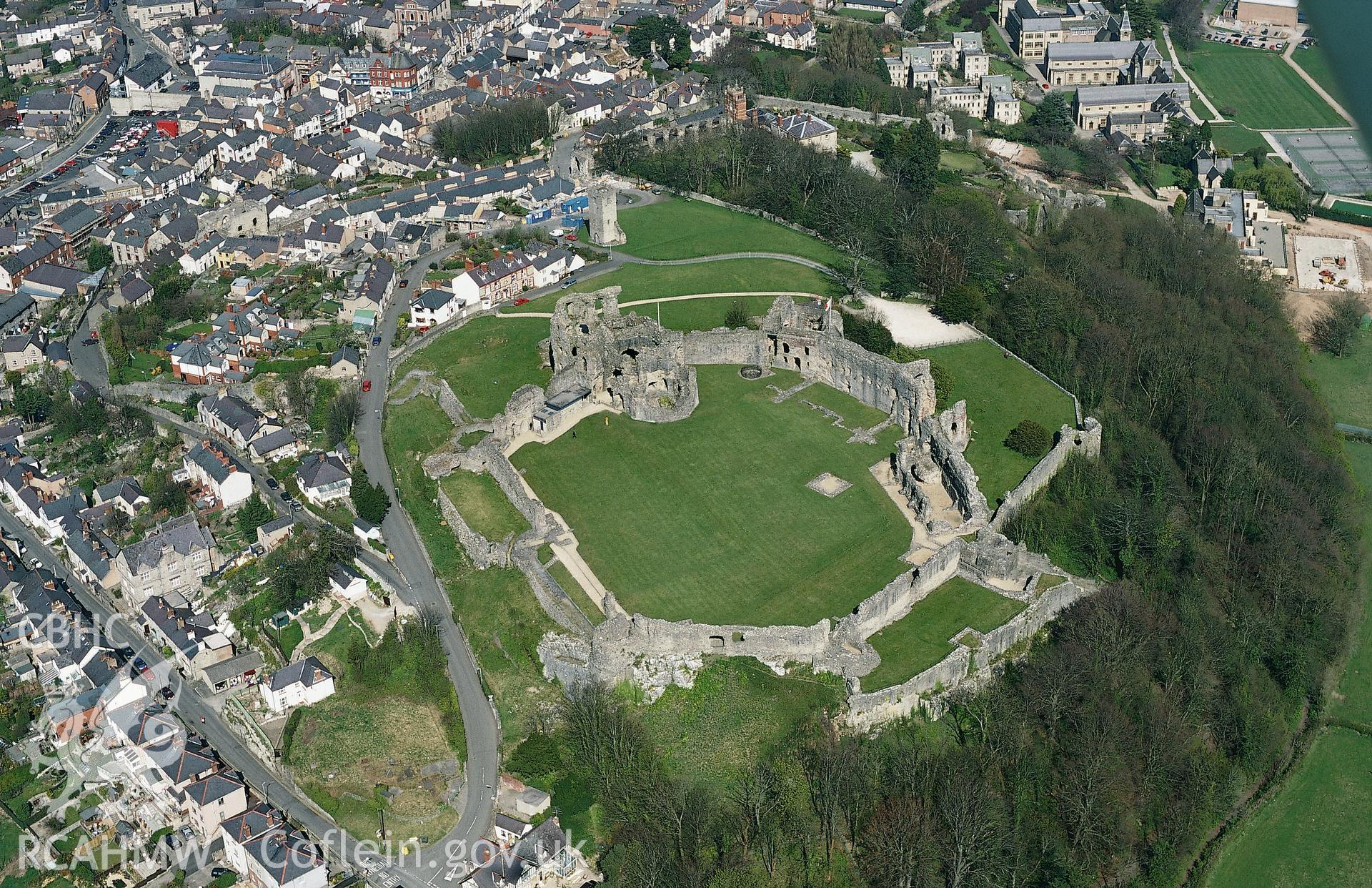 RCAHMW colour oblique aerial photograph of Denbigh, castle and town, from south. Taken by Toby Driver on 08/04/2003.