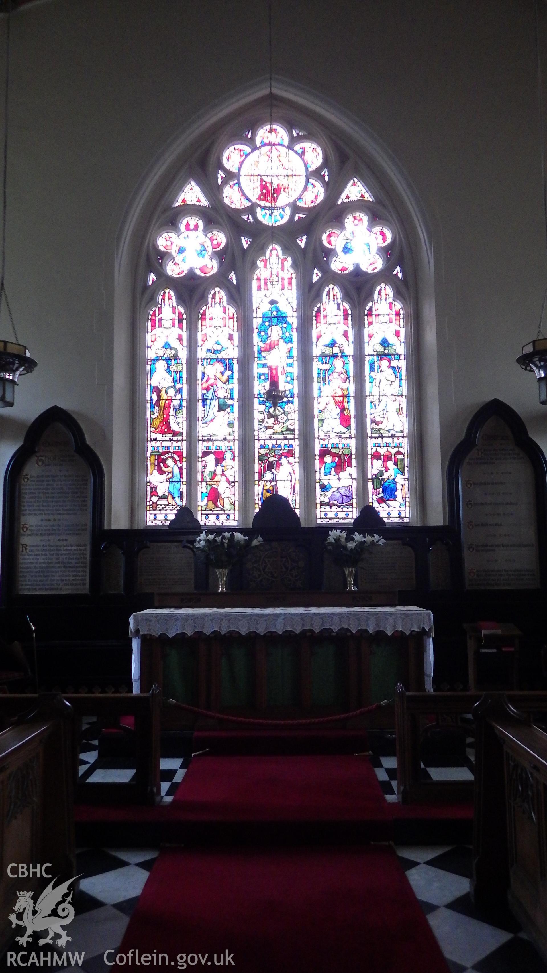 Altar and stained glass window, with prayer/bible verse boards