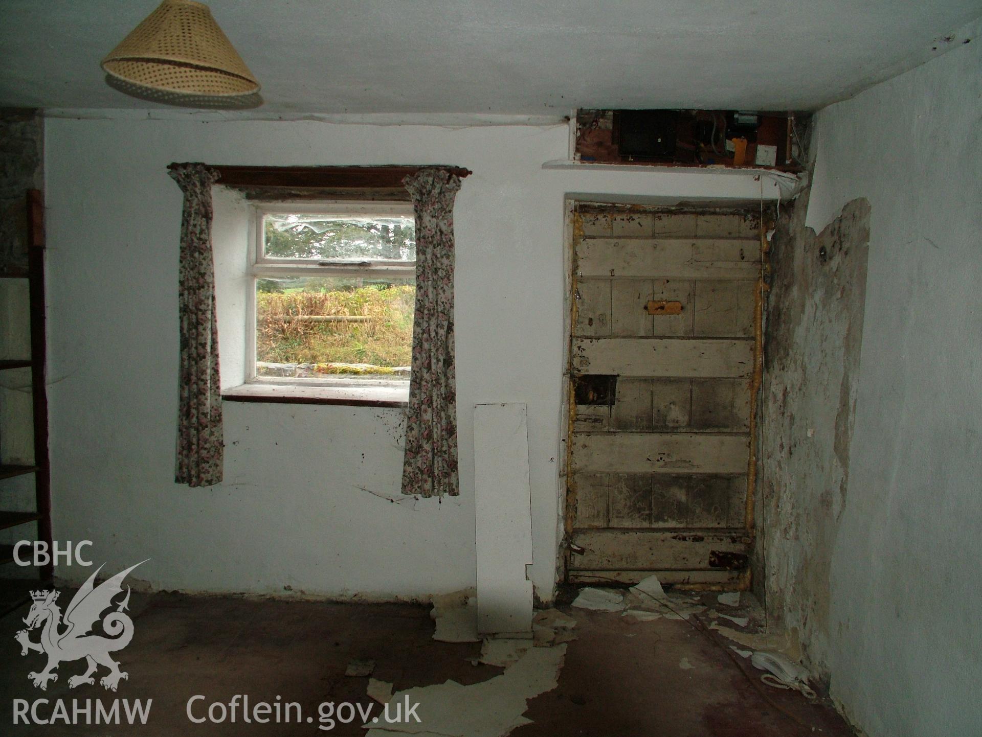Digital colour photograph showing Llwynypandy chapel house - interior, view of window and door