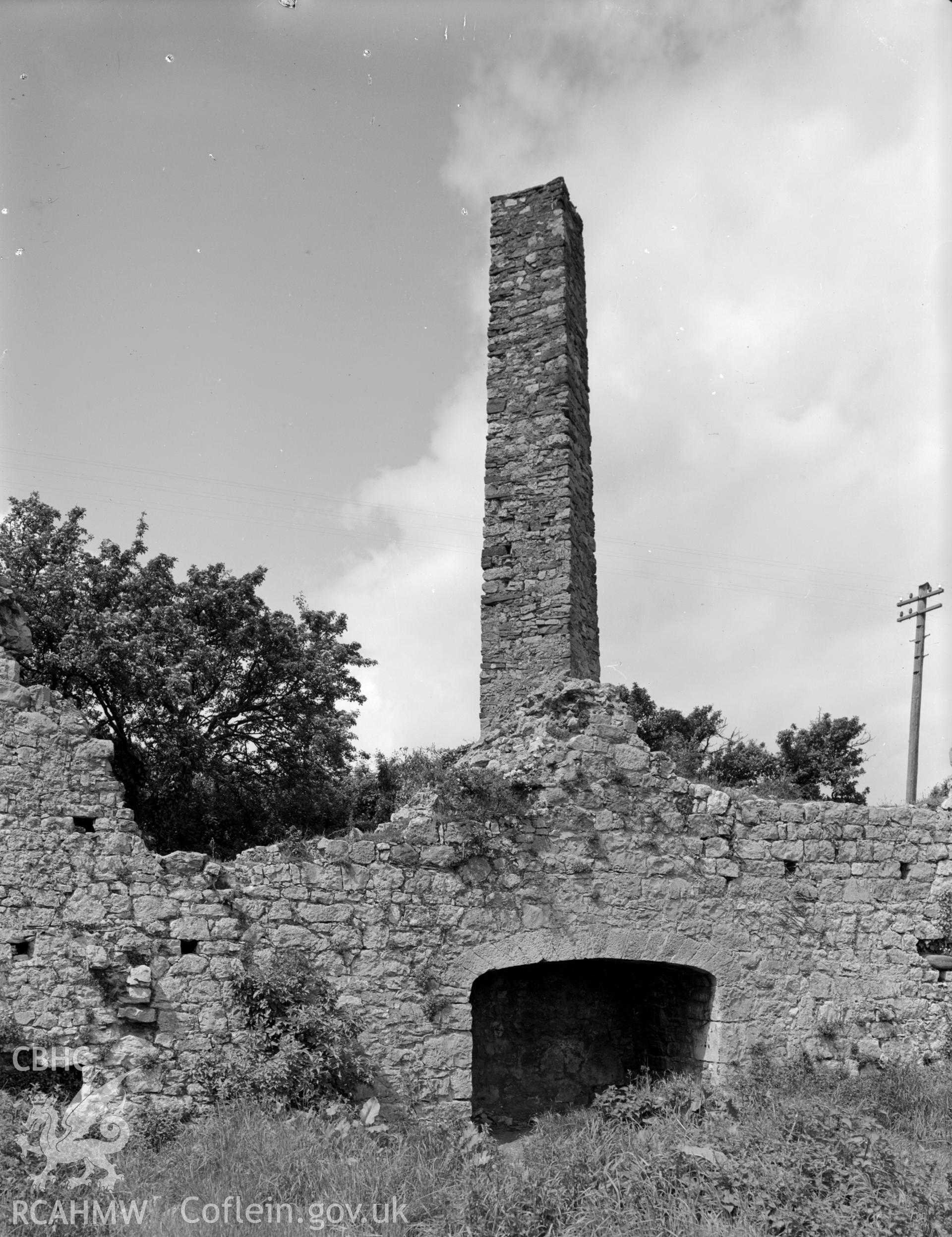 A view of a diagonal chimney and fireplace remains