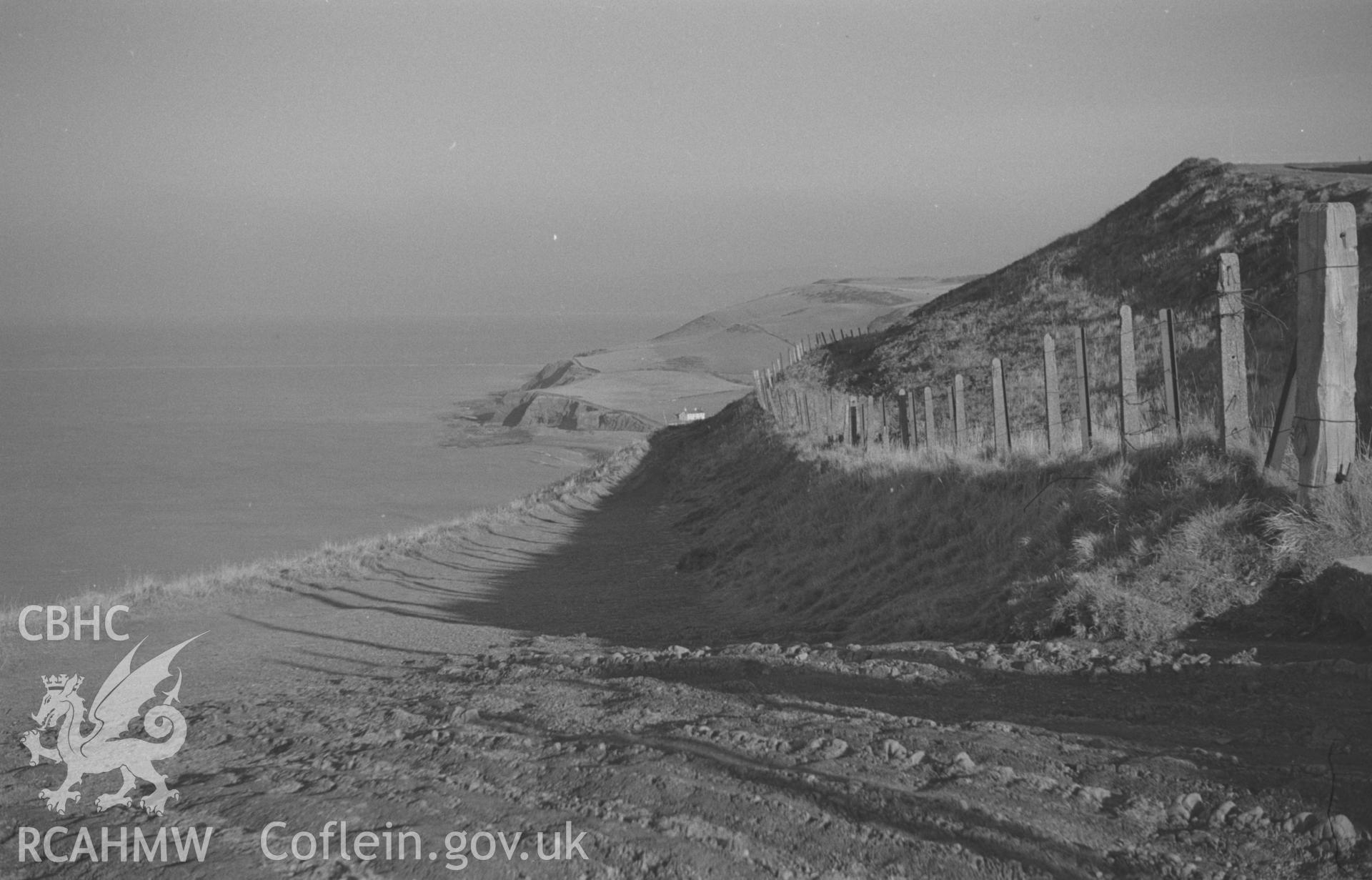 Black and White photograph showing cliff path to Clarach from the top of Constitution Hill, Aberystwyth. Photographed by Arthur Chater in December 1962 from Grid Reference SN 584 829, looking north north east.