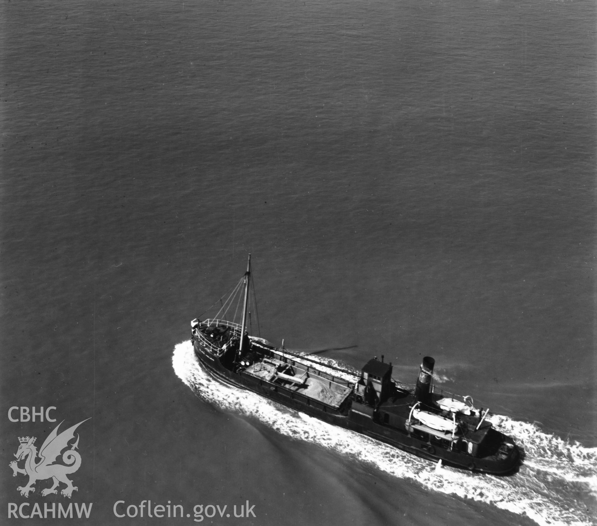 Close view of cargo ship in the Bristol Channel (Helen). Oblique aerial photograph, 5?" cut roll film.