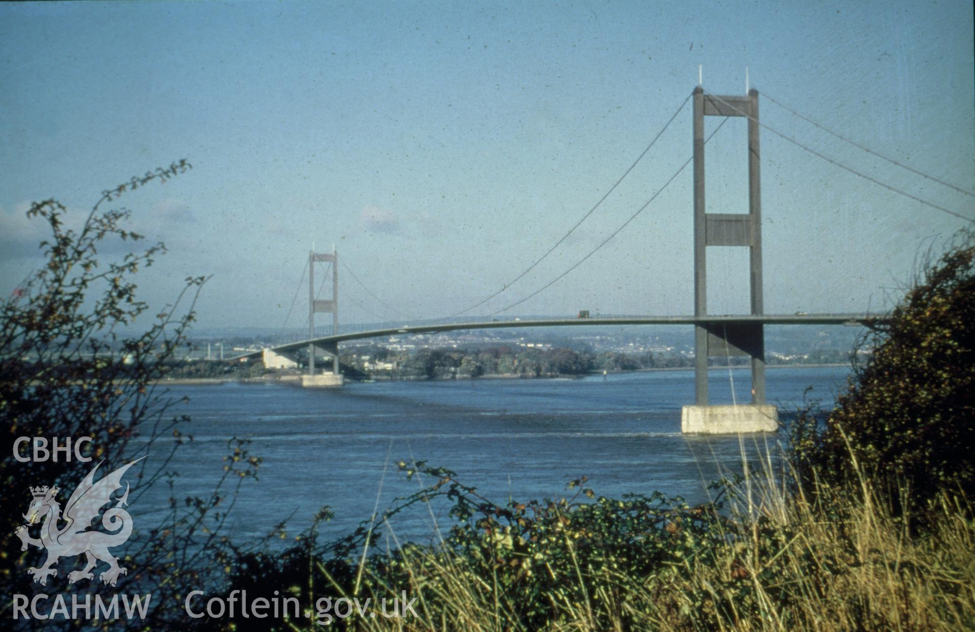Digital copy of a colour slide showing view of Severn Bridge from Aust Beach taken by Douglas Hague c,1970.
