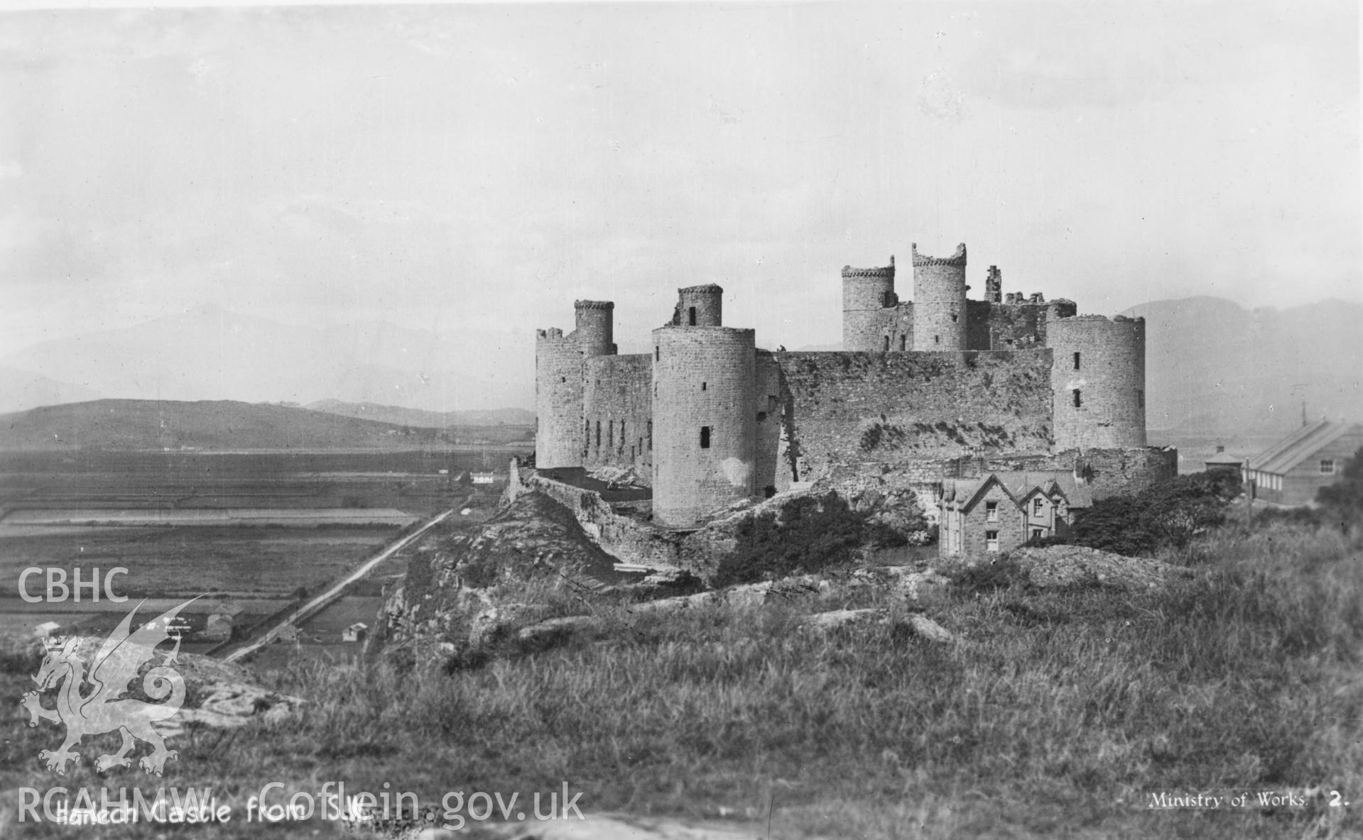 Digital copy of a black and white postcard relating to Harlech Castle: general view from south-west.