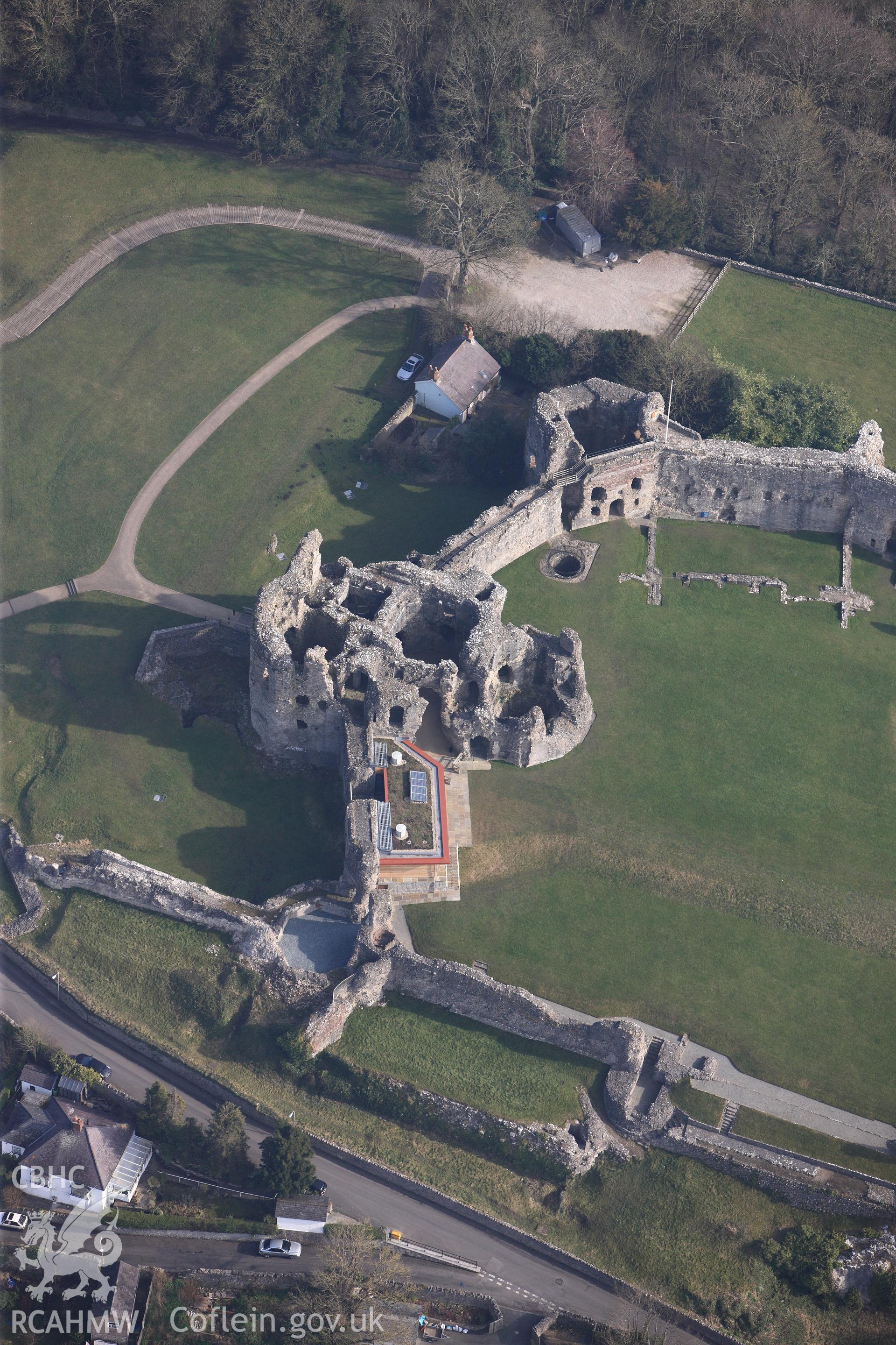 Denbigh Castle, its Cadw visitor's centre, and Castle Cottage bowling green house, Denbigh. Oblique aerial photograph taken during the Royal Commission?s programme of archaeological aerial reconnaissance by Toby Driver on 28th February 2013.