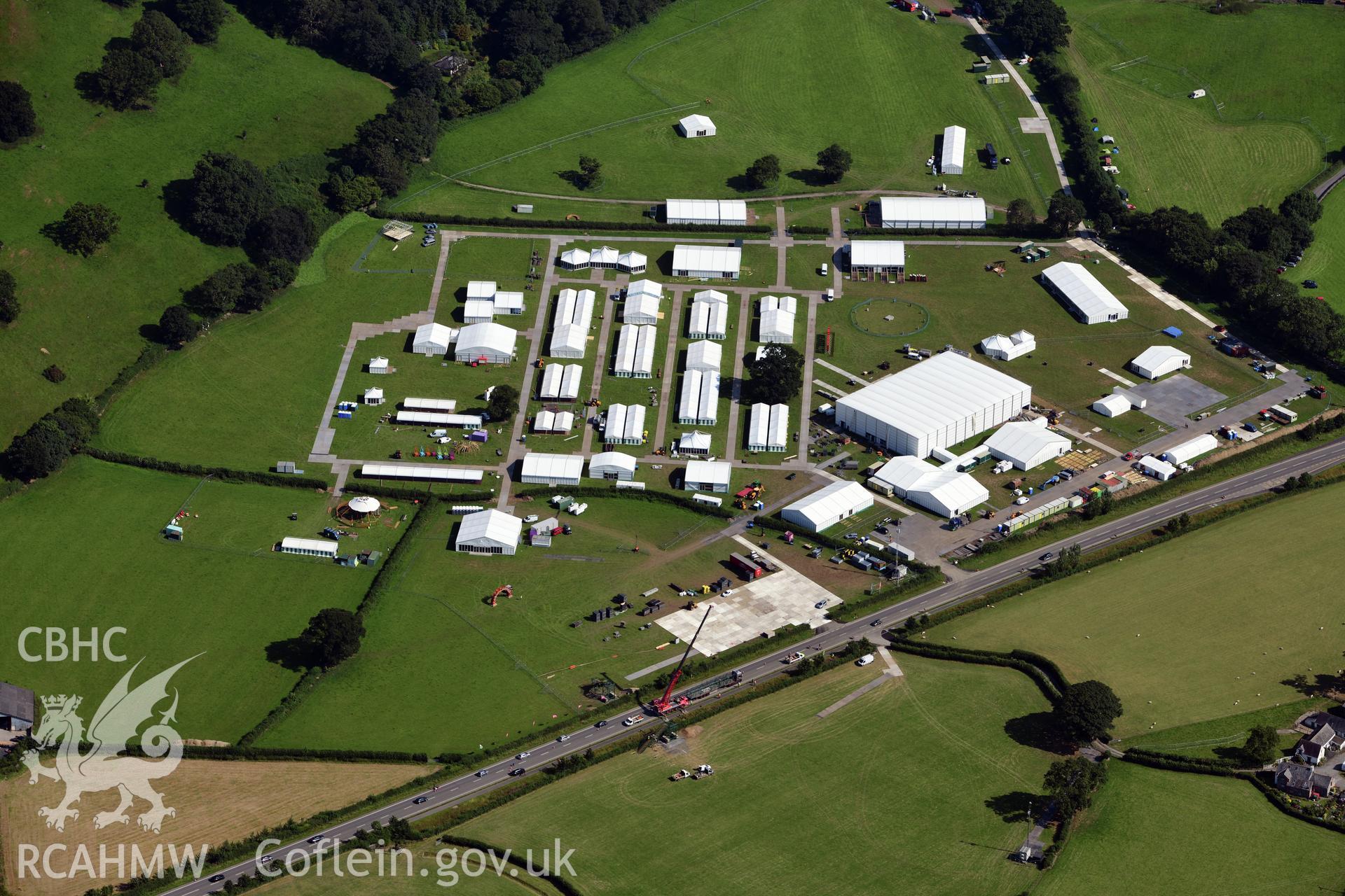 Maes yr Eisteddfod 2019, a mile to the south of Llanrwst town. Photographed during the process of setting up. Oblique aerial photograph taken during the Royal Commission?s programme of archaeological aerial reconnaissance by Toby Driver on 23rd July 2019.