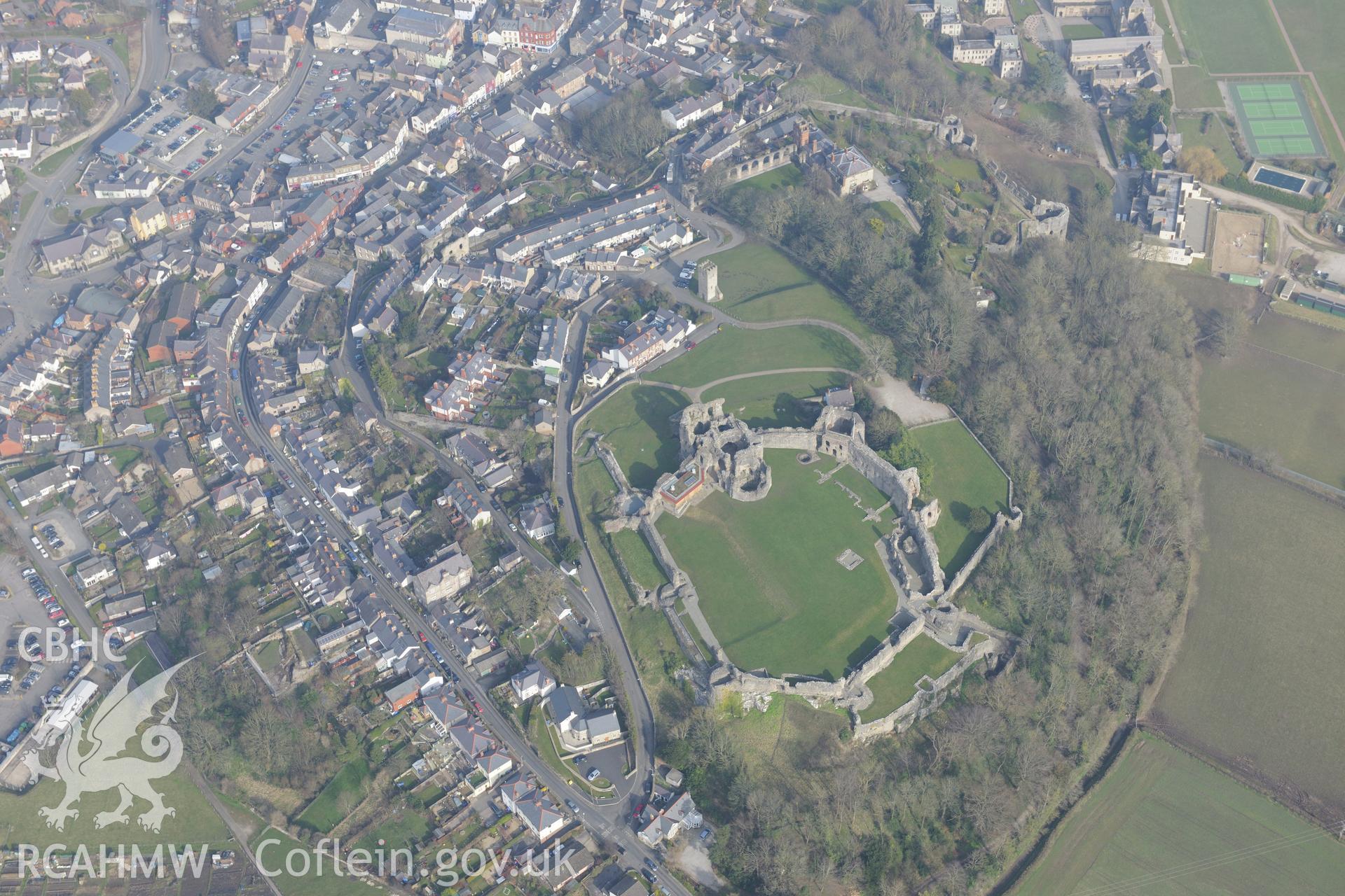 Denbigh Castle and visitor's centre, St. Hilary's chapel, Denbigh town wall, and Castle House, Denbigh. Oblique aerial photograph taken during the Royal Commission?s programme of archaeological aerial reconnaissance by Toby Driver on 28th February 2013.