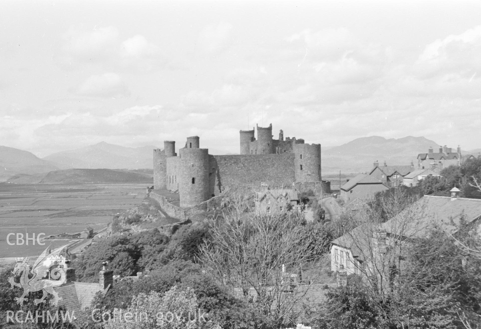 Digital copy of a black and white negative showing a general view of Harlech Castle from south.