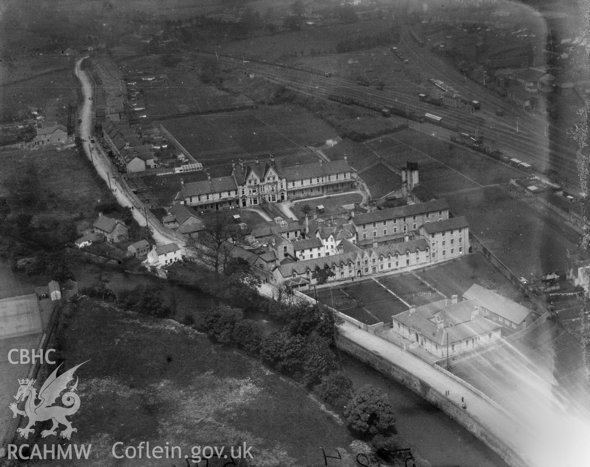 View of Bridgend showing workhouse, oblique aerial view. 5?x4? black and white glass plate negative.