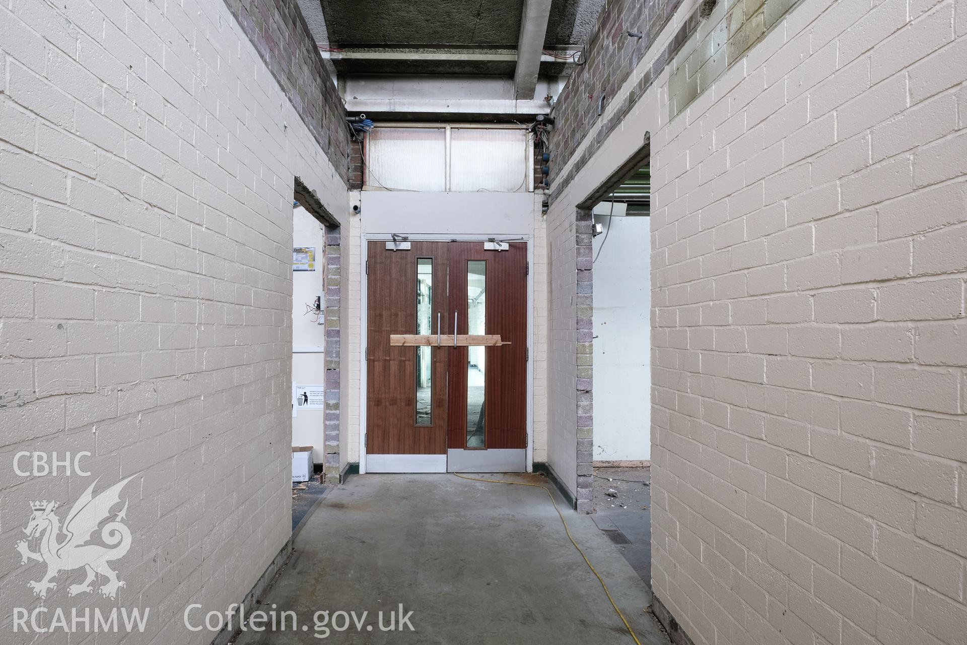 Digital colour photograph showing interior view of hallway at Caernarfonshire Technical College, Ffriddoedd Road, Bangor. Photographed by Dilys Morgan and donated by Wyn Thomas of Grwp Llandrillo-Menai Further Education College, 2019.