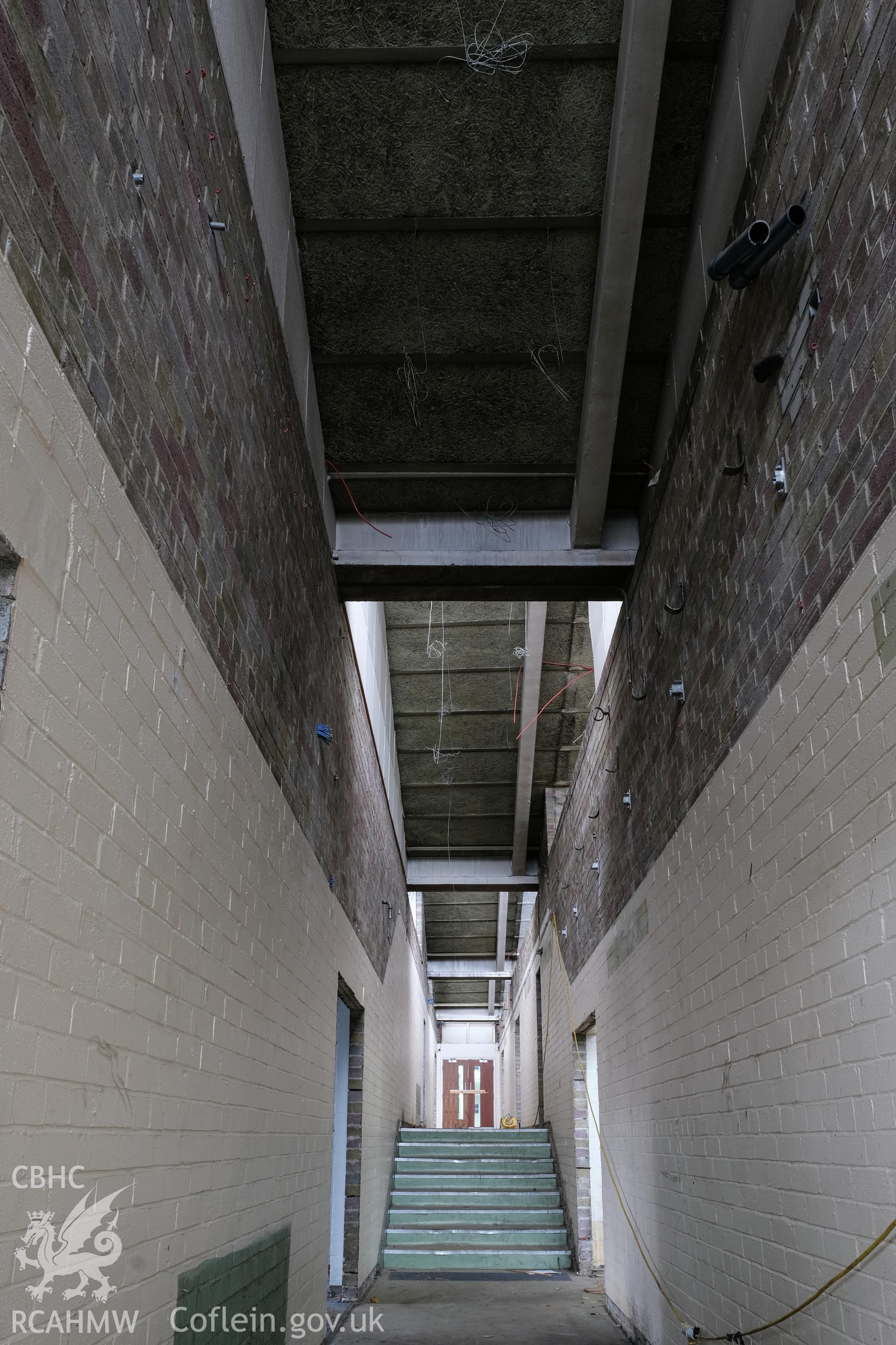 Digital colour photograph showing interior view of corridor at Caernarfonshire Technical College, Ffriddoedd Road, Bangor. Photographed by Dilys Morgan and donated by Wyn Thomas of Grwp Llandrillo-Menai Further Education College, 2019.