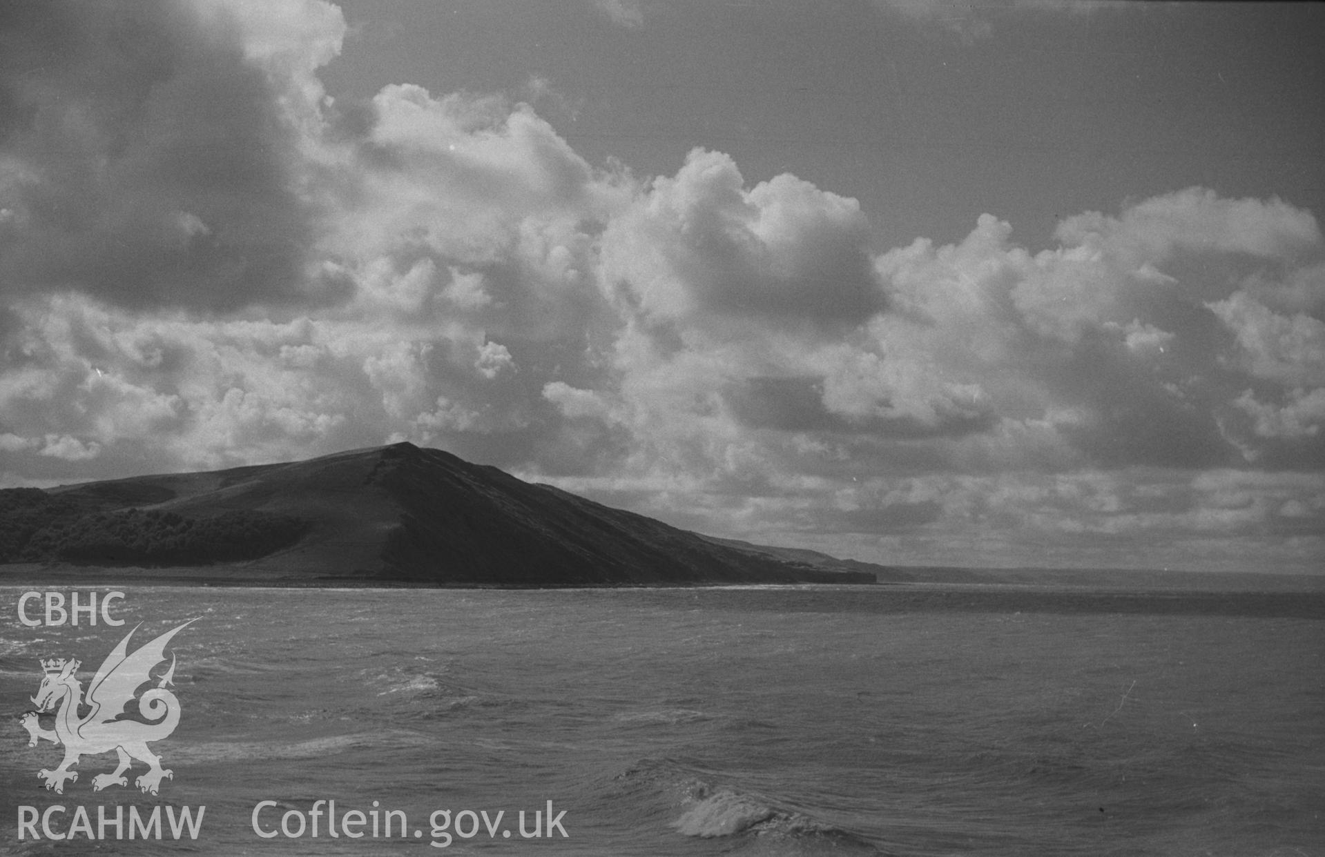Digital copy of a black and white negative showing view of Alltwen hill from Tanybwlch beach, Aberystwyth. Photographed by Arthur O. Chater in September 1964 from Tanybwlch pier. Grid Reference SN 5785 8078. (Panorama. Photograph 9 of 10).