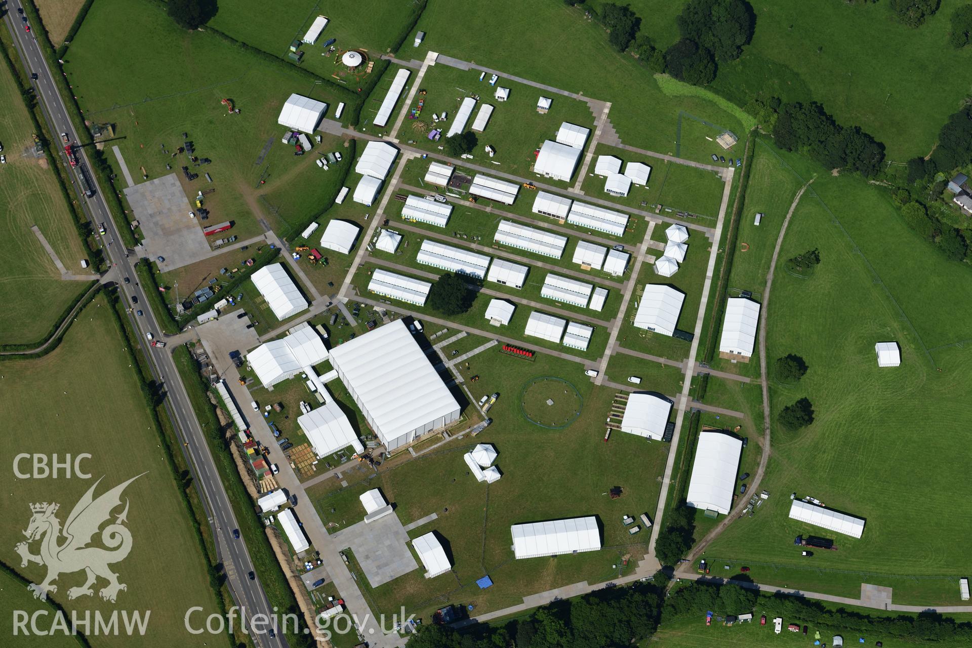 Maes yr Eisteddfod 2019, a mile to the south of Llanrwst town. Photographed during the process of setting up. Oblique aerial photograph taken during the Royal Commission?s programme of archaeological aerial reconnaissance by Toby Driver on 23rd July 2019.
