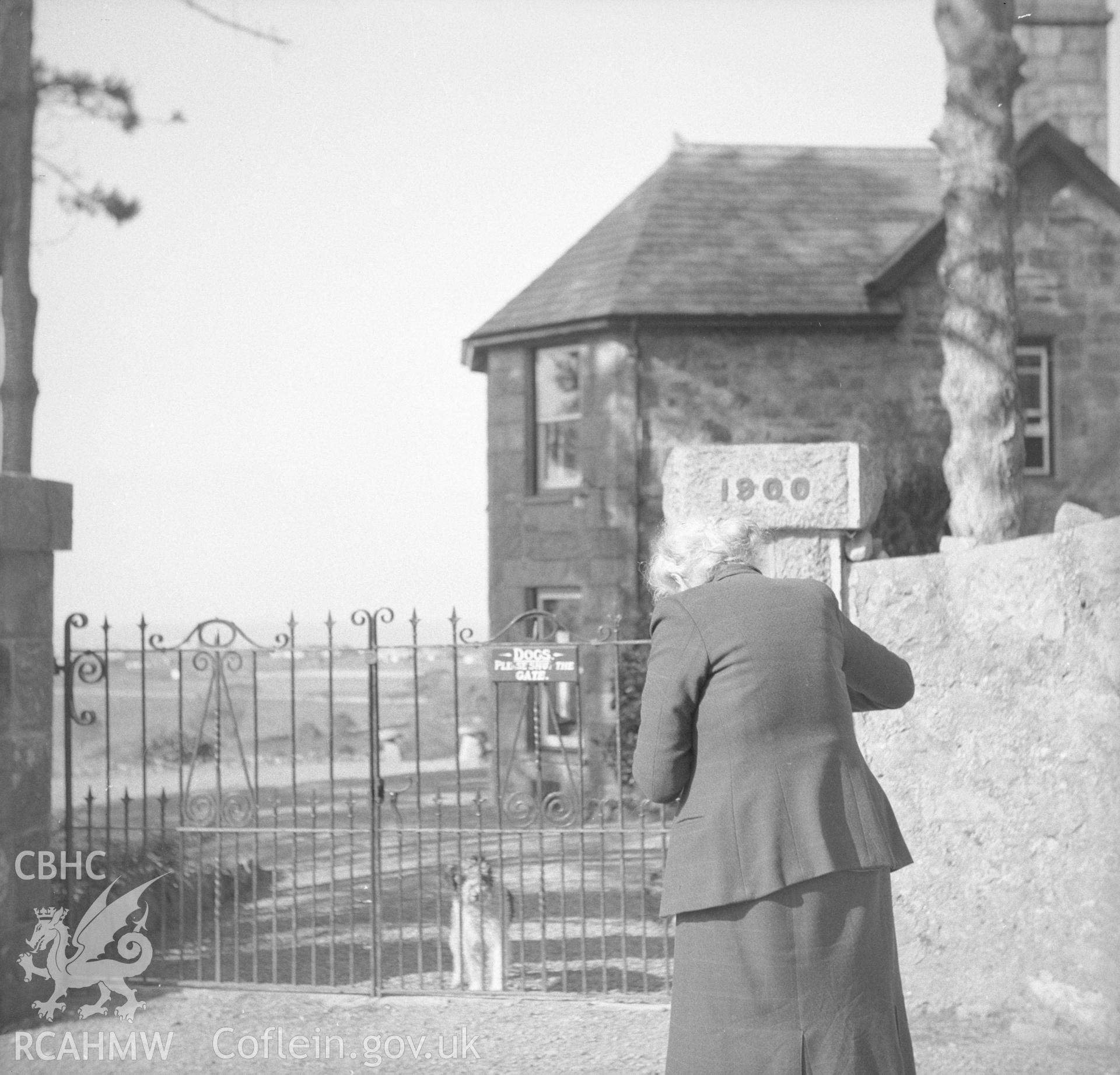 Digital copy of an undated nitrate negative showing a view of figure at the entrance of Coed Mawr, Merioneth.