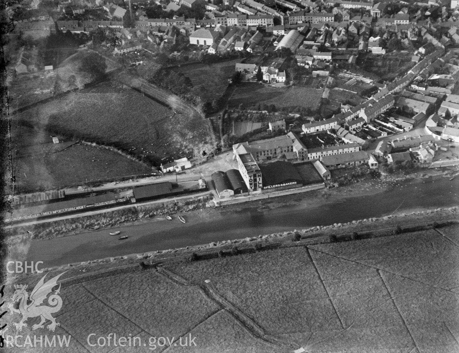 View of Carmarthen showing river and Towy Mill, oblique aerial view. 5?x4? black and white glass plate negative.