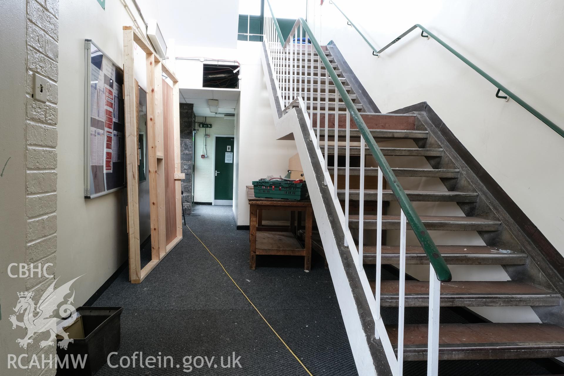 Digital colour photograph showing detailed interior view of hallway and stairs at Caernarfonshire Technical College, Ffriddoedd Road, Bangor. Photographed by Dilys Morgan and donated by Wyn Thomas of Grwp Llandrillo-Menai Further Education College, 2019.