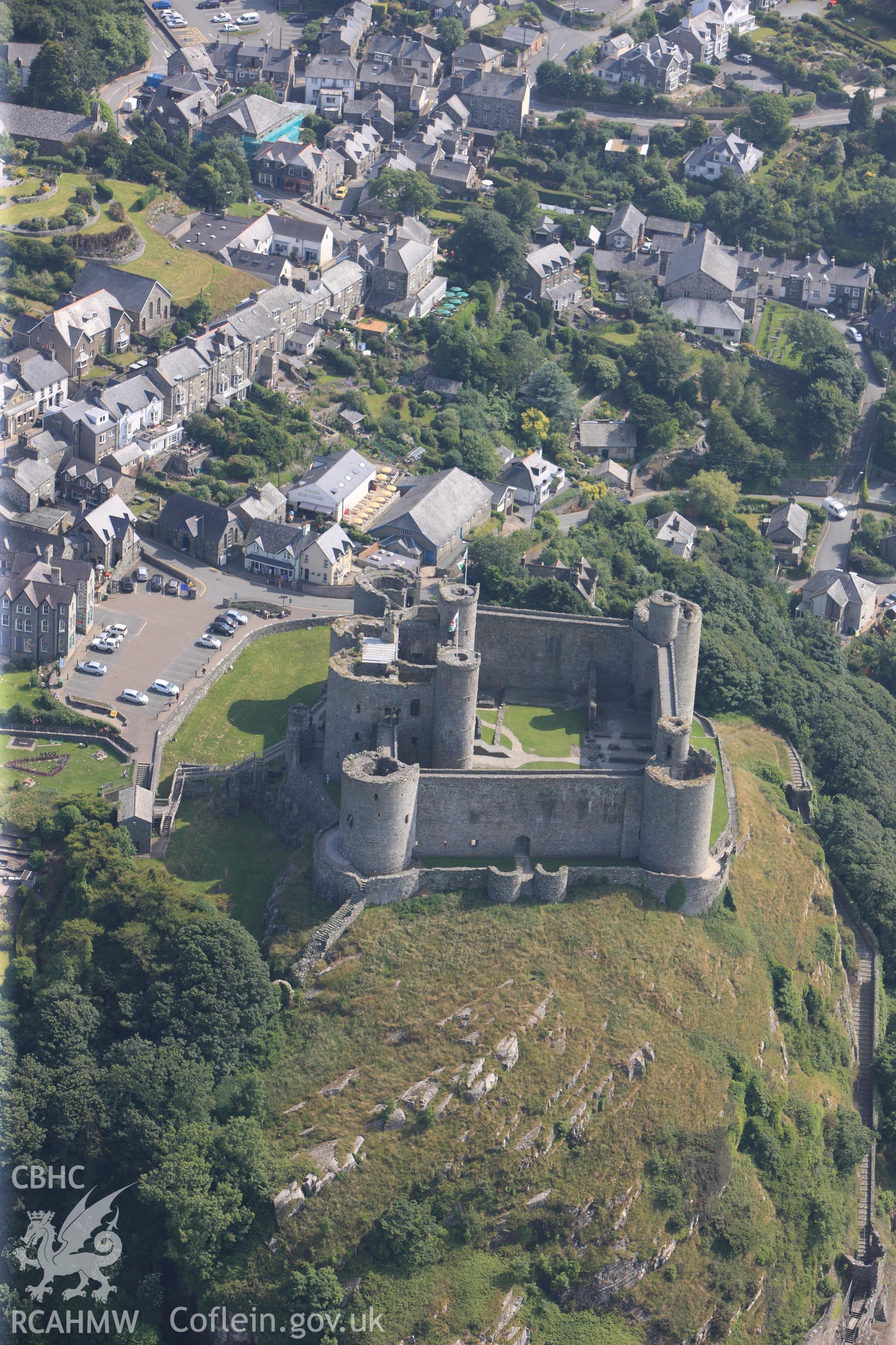 Harlech Castle, overlooking Harlech. Oblique aerial photograph taken during the Royal Commission?s programme of archaeological aerial reconnaissance by Toby Driver on 12th July 2013.