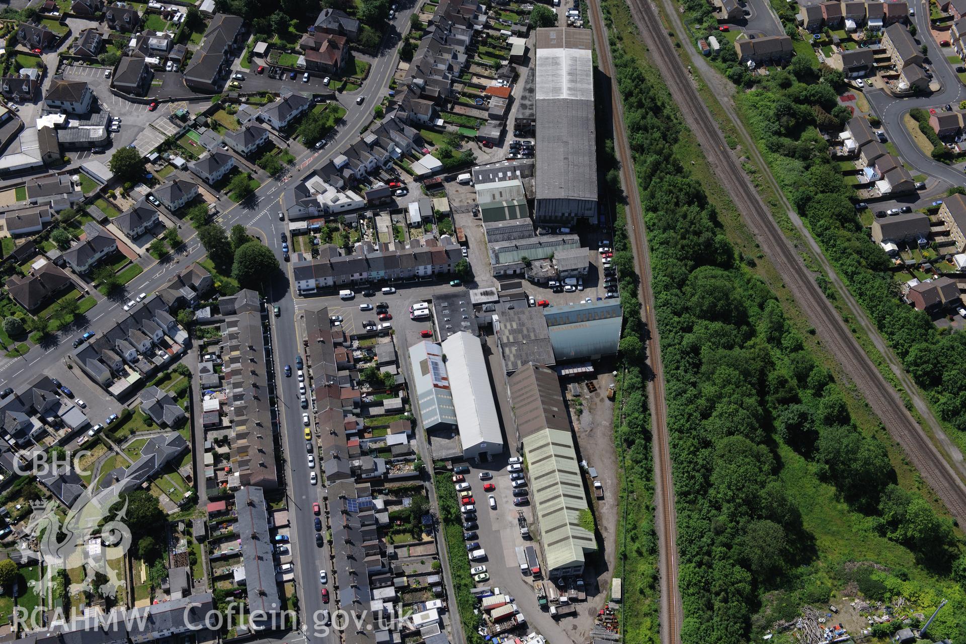 Railway and industrial units on Australia Terrace, behind Coity Road, Bridgend. Oblique aerial photograph taken during the Royal Commission's programme of archaeological aerial reconnaissance by Toby Driver on 19th June 2015.