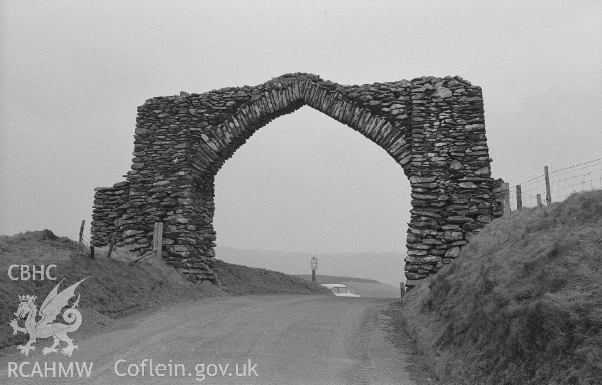 Black and White photograph showing the Jubilee Arch, Pontarfynach, at 1,223ft., from the west. Photographed by Arthur Chater in April 1963, from Grid Reference SN 765 756, looking east.