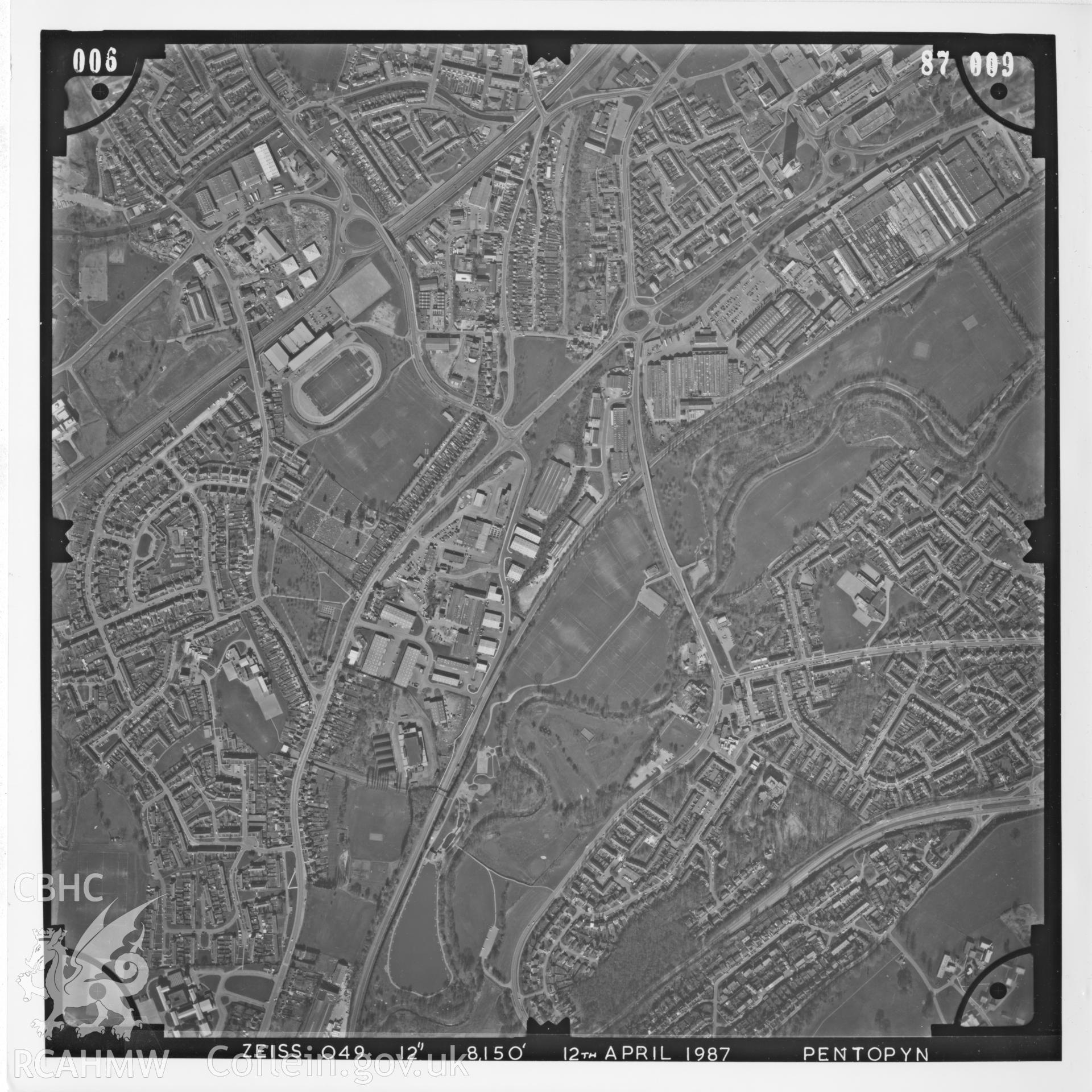 Aerial photograph of Cwmbran, taken on 12th April 1987. Included as part of Archaeology Wales' desk based assessment of former Llantarnam Community Primary School, Croeswen, Oakfield, Cwmbran, conducted in 2017.