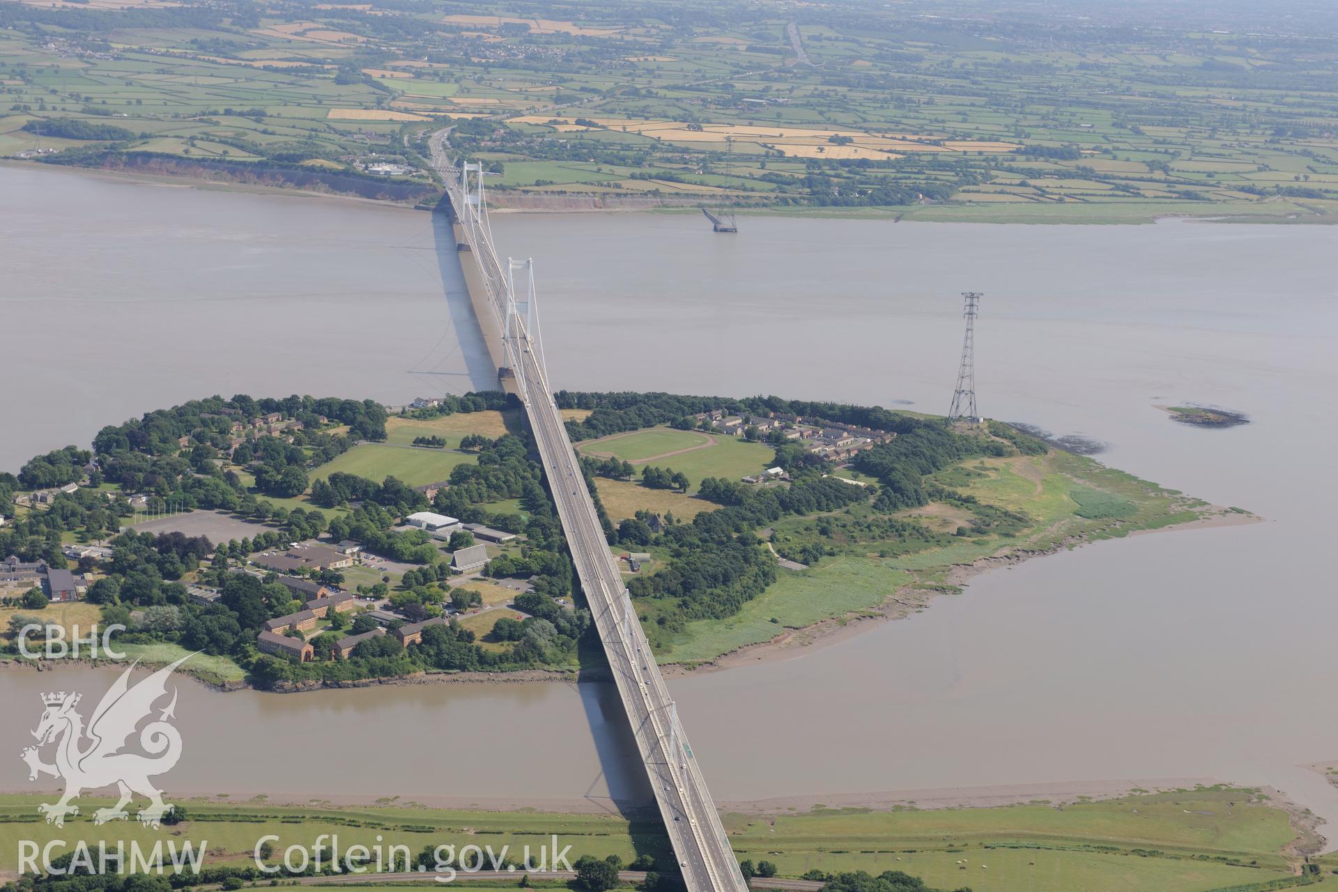 The Severn Bridge, carrying the M48 motorway over the River Wye (bottom of the photograph) and on across the River Severn. Oblique aerial photograph taken during the Royal Commission?s programme of archaeological aerial reconnaissance by Toby Driver on 1st August 2013.